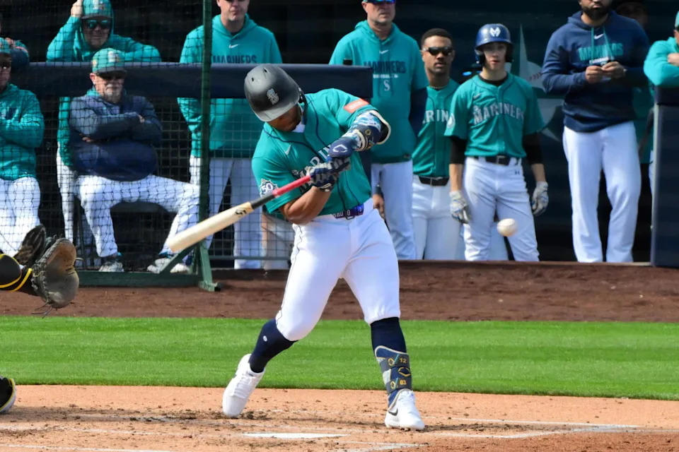 Seattle Mariners shortstop Michael Arroyo (96) hits a two run home run in the second inning against the San Diego Padres during a Spring Training game at Peoria Sports Complex. Matt Kartozian-Imagn Images