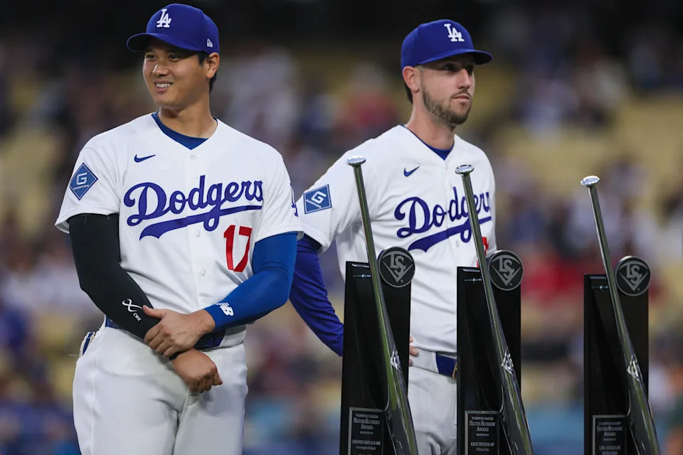 Los Angeles, CA - March 30: Los Angeles Dodgers two-way player Shohei Ohtani (17) smiles while standing next to teammate Los Angeles Dodgers right fielder Kyle Tucker (23) as they receive Silver Slugger awards prior to the start of a MLB game between the Los Angeles Dodgers and the Cleveland Guardians at Dodger Stadium on Monday, March 30, 2026 in Los Angeles, CA. (Photo by Ronaldo Bolaños/Los Angeles Times via Getty Images)