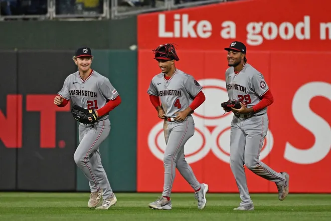 Mar 30, 2026; Philadelphia, Pennsylvania, USA; Washington Nationals left fielder Joey Wiemer (21), right fielder Daylen Lile (4) and left fielder James Wood (29) celebrate win against the Philadelphia Phillies at Citizens Bank Park.