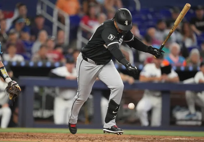 Apr 1, 2026; Miami, Florida, USA; Chicago White Sox designated hitter Miguel Vargas (20) tries to get out of the way of the ball as he runs to first base in the seventh inning against the Miami Marlins at loanDepot Park.