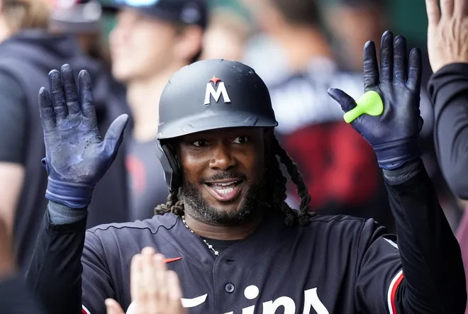 Apr 2, 2026; Kansas City, Missouri, USA; Minnesota Twins first baseman Josh Bell (56) is congratulated by teammates after hitting a home run during the ninth inning against the Kansas City Royals at Kauffman Stadium.