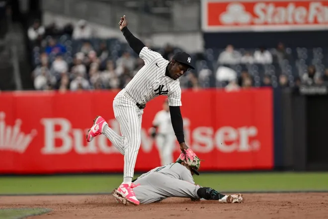 Apr 5, 2026; Bronx, New York, USA; Miami Marlins second baseman Otto Lopez (6) steals second base ahead of the tag by New York Yankees second baseman Jazz Chisholm Jr. (13) during the sixth inning at Yankee Stadium.