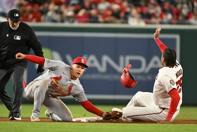 Apr 7, 2026; Washington, District of Columbia, USA; Washington Nationals left fielder James Wood (29) steals second base as St. Louis Cardinals shortstop JJ Wetherholt (26) attempts the tag during the sixth inning at Nationals Park.