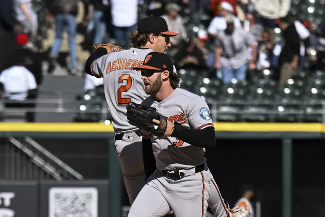 Apr 8, 2026; Chicago, Illinois, USA; Baltimore Orioles shortstop Gunnar Henderson (2) and left fielder Taylor Ward (3) celebrate after the game against the Chicago White Sox at Rate Field.