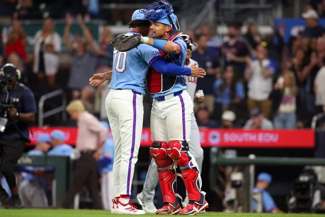 Apr 10, 2026; Atlanta, Georgia, USA; Atlanta Braves relief pitcher Osvaldo Bido (70) celebrates with catcher Drake Baldwin (30) after a victory over the Cleveland Guardians at Truist Park.