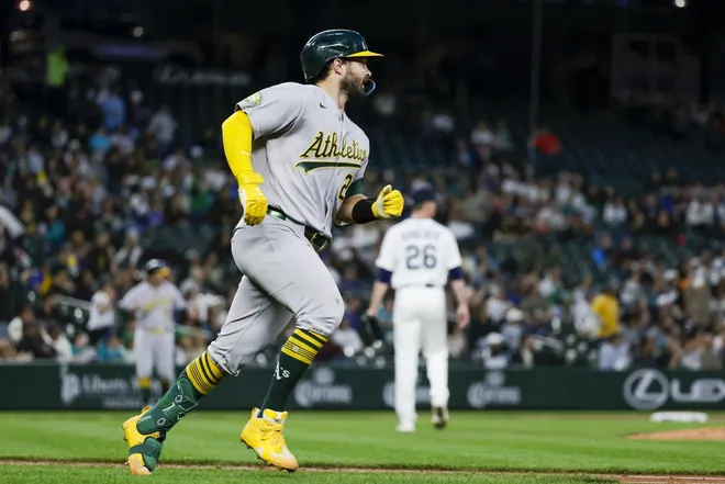 Apr 20, 2026; Seattle, Washington, USA; Athletics catcher Shea Langeliers (23) hits a home run against the Seattle Mariners during the sixth inning at T-Mobile Park.