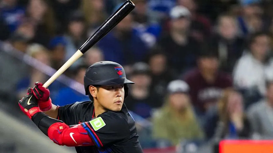 Kazuma Okamoto in the batters box swinging the bat.