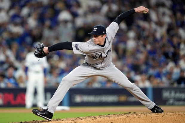 New York Yankees relief pitcher Tim Hill throws to the plate during the sixth inning of Game 2 of the World Series against the Dodgers on Saturday night at Dodger Stadium. (AP Photo/Godofredo A. Vásquez)