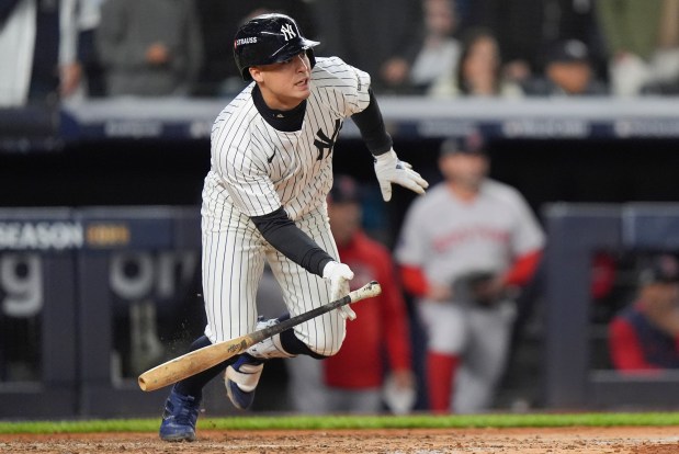 New York Yankees Anthony Volpe heads for first base after hitting an RBI single against the Boston Red Sox during the fourth inning of Game 3 of an American League wild-card baseball playoff series, Thursday, Oct. 2, 2025, in New York. (AP Photo/Frank Franklin II)
