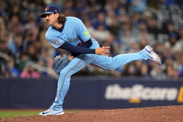 Toronto Blue Jays pitcher Kevin Gausman (34) throws during the sixth inning of a baseball game against the Colorado Rockies in Toronto, Wednesday, April 1, 2026. (Nathan Denette/The Canadian Press via AP)