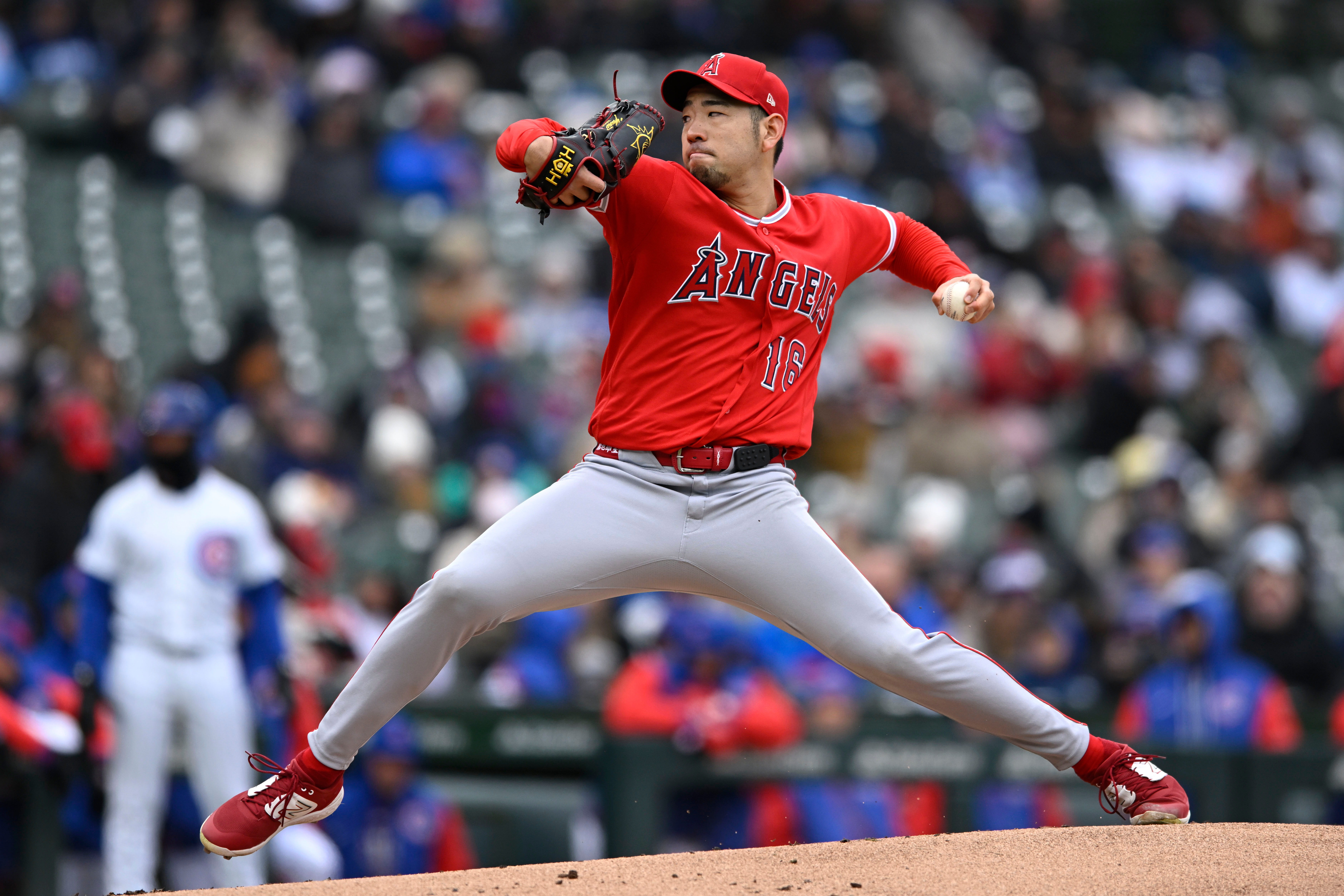 Angels starting pitcher Yusei Kikuchi throws to the plate during...