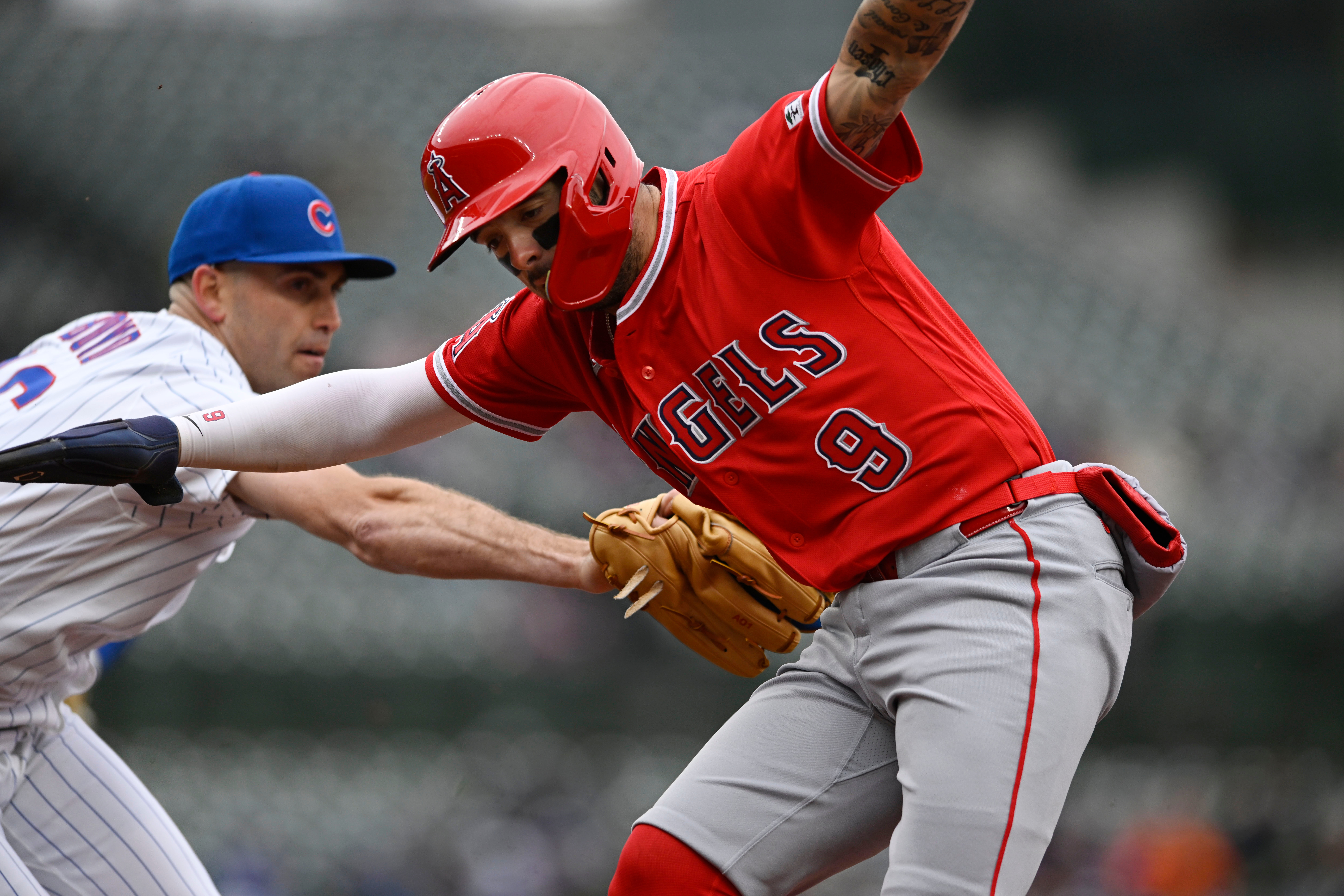 The Angels’ Zach Neto, right, is tagged out by Chicago...
