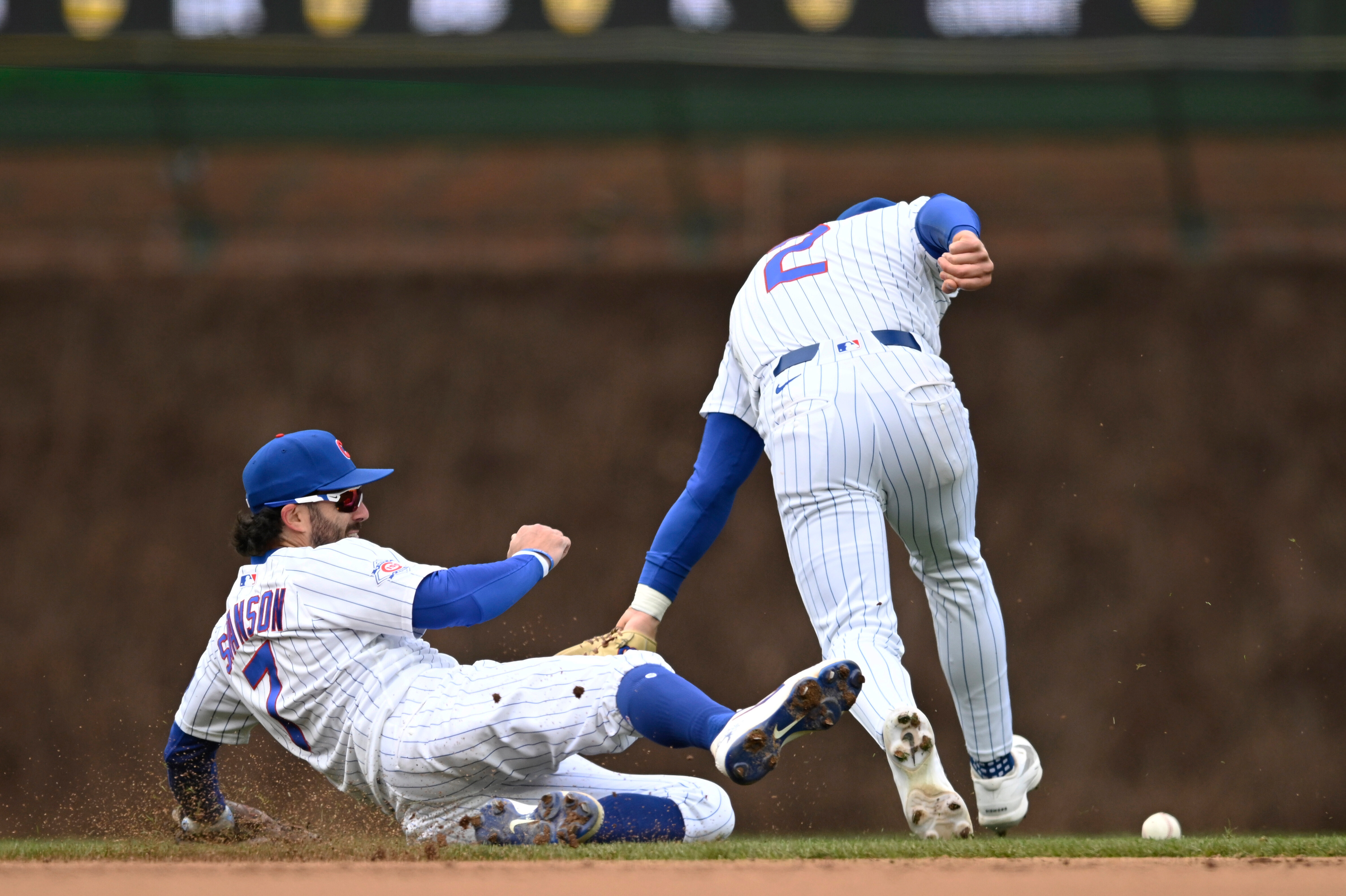 Chicago Cubs shortstop Dansby Swanson, left, and second baseman Nico...