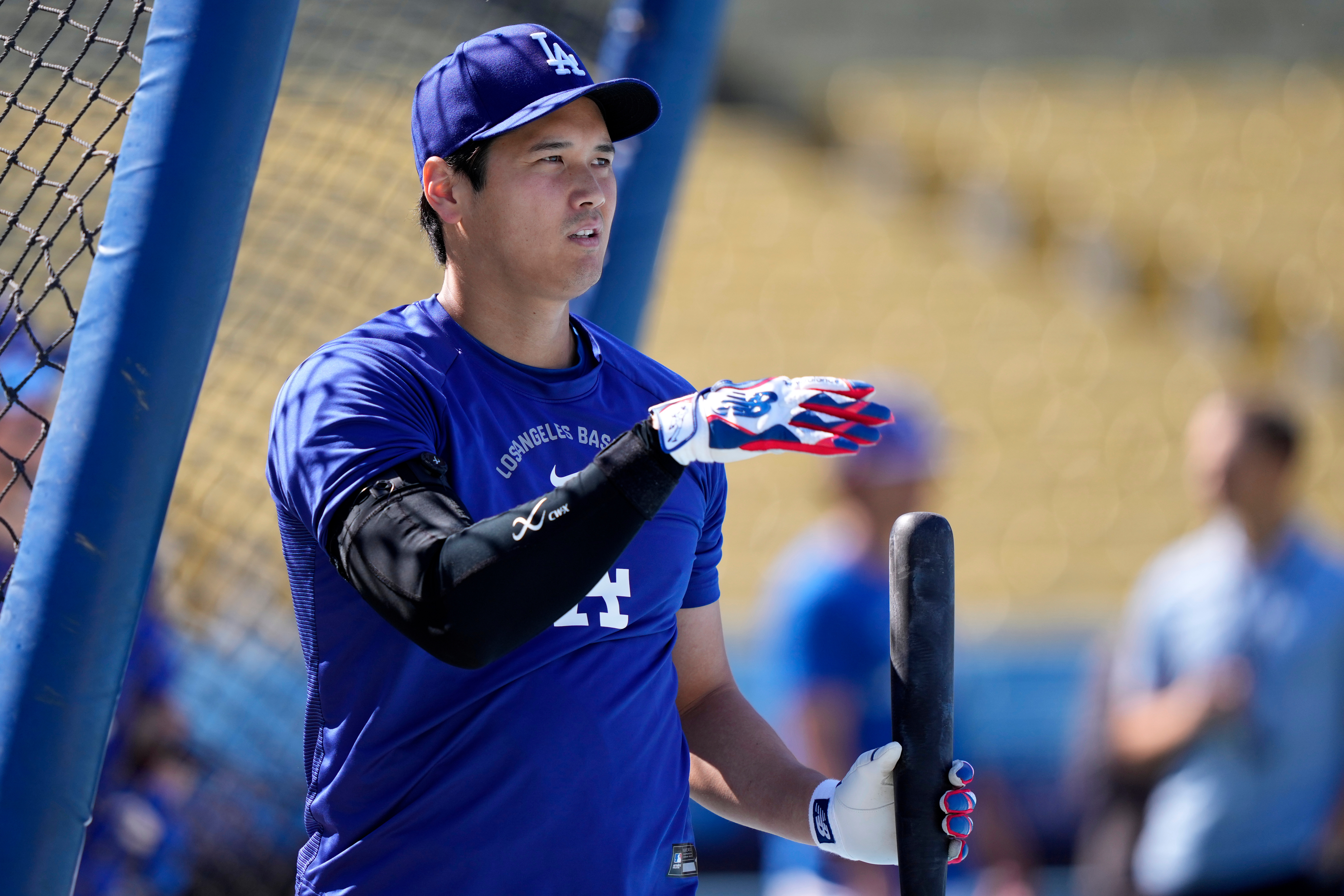 Dodgers star Shohei Ohtani takes batting practice before a game...