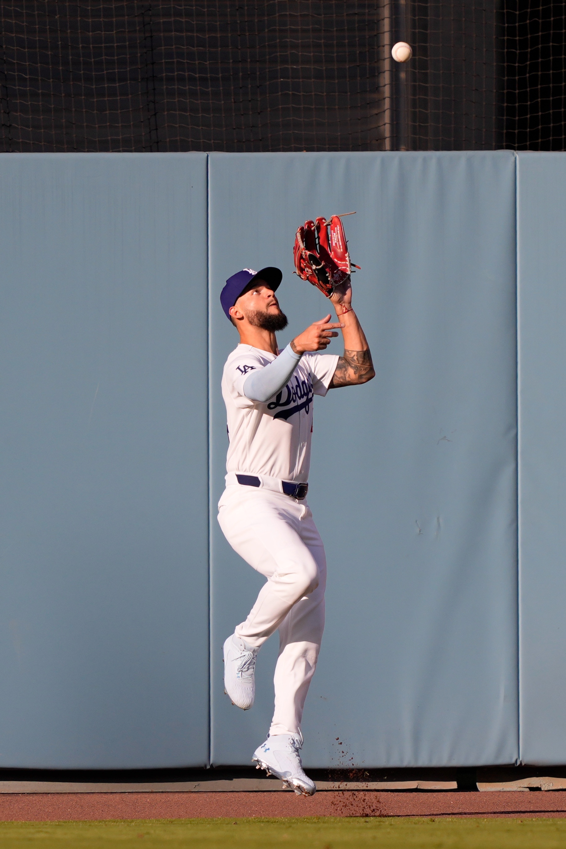 Dodgers center fielder Andy Pages makes a catch on a...