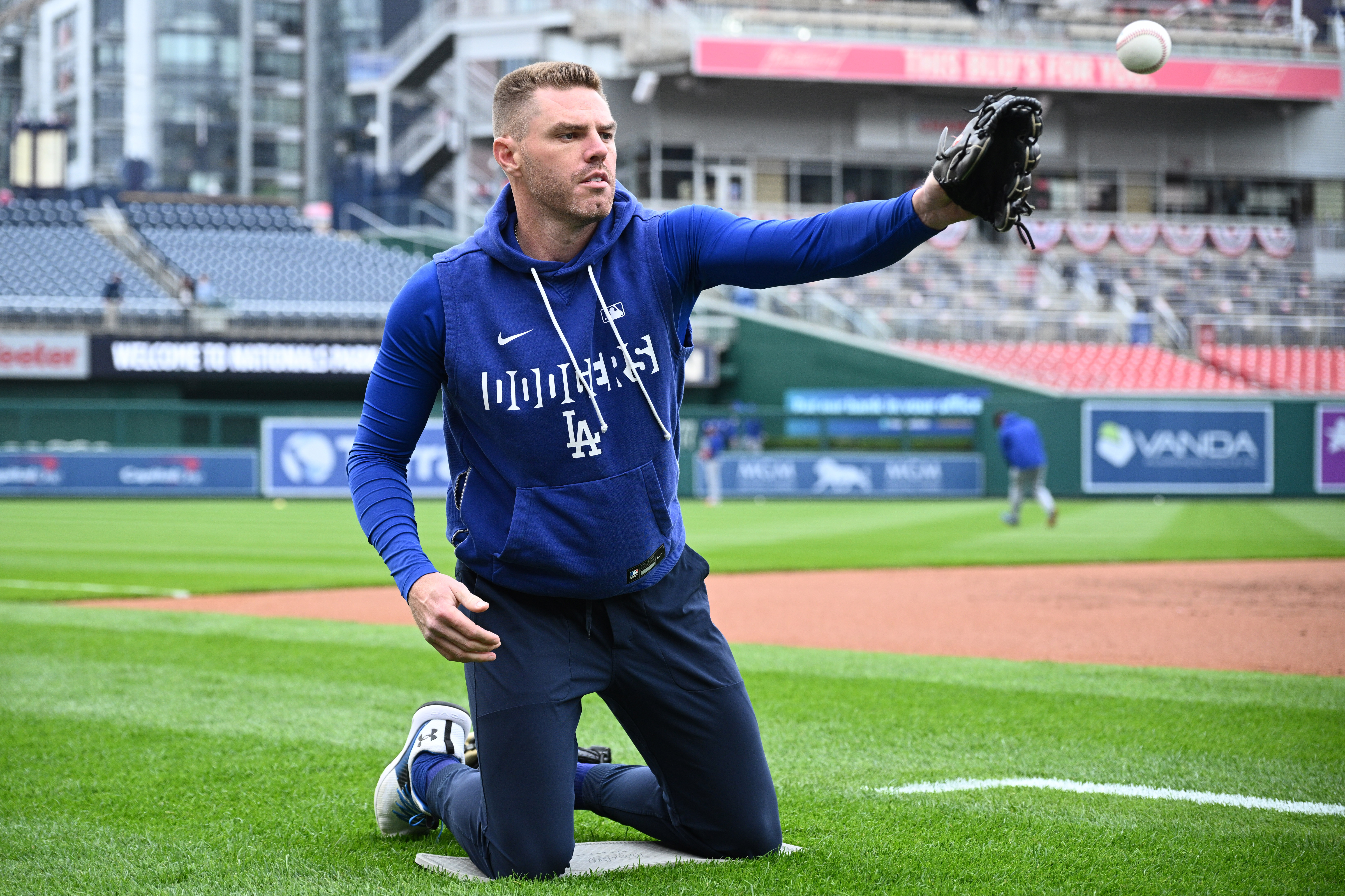 Dodgers first baseman Freddie Freeman works out before a game...