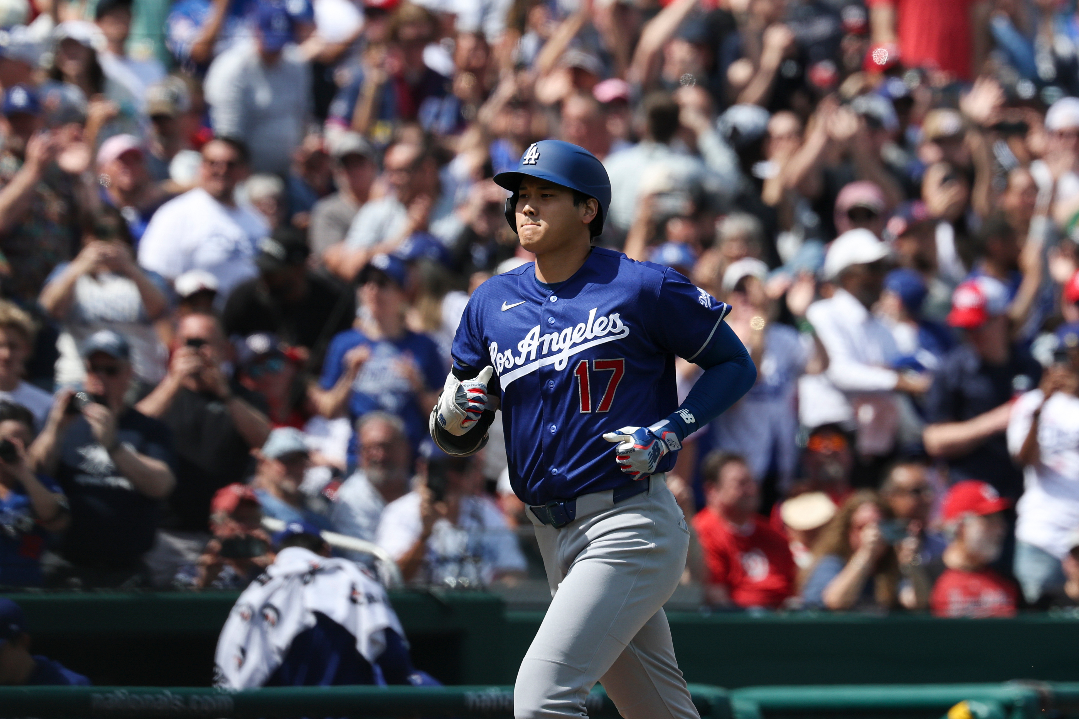 Dodgers star Shohei Ohtani (17) runs the bases after hitting...