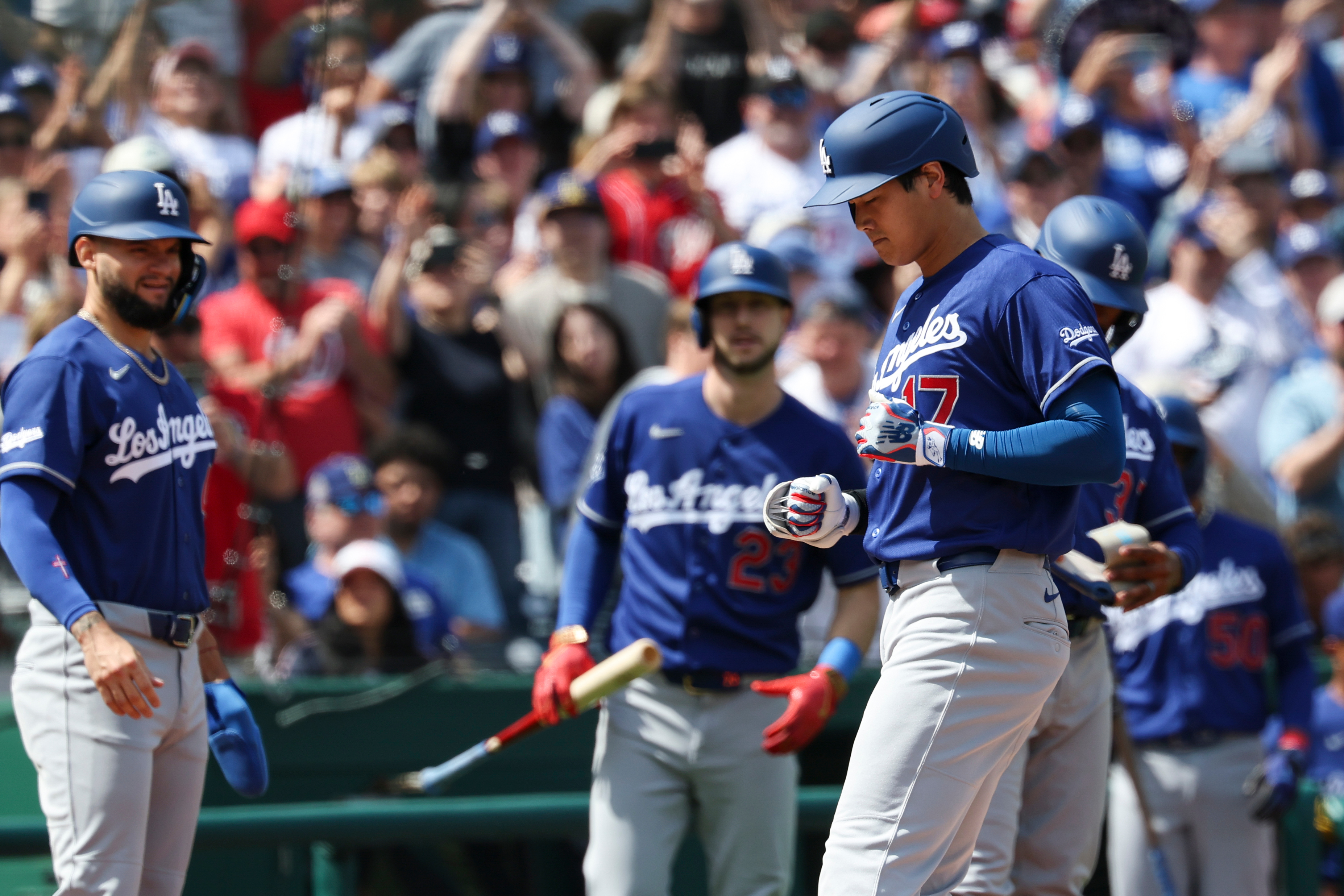 Dodgers star Shohei Ohtani (17) steps on home plate after...