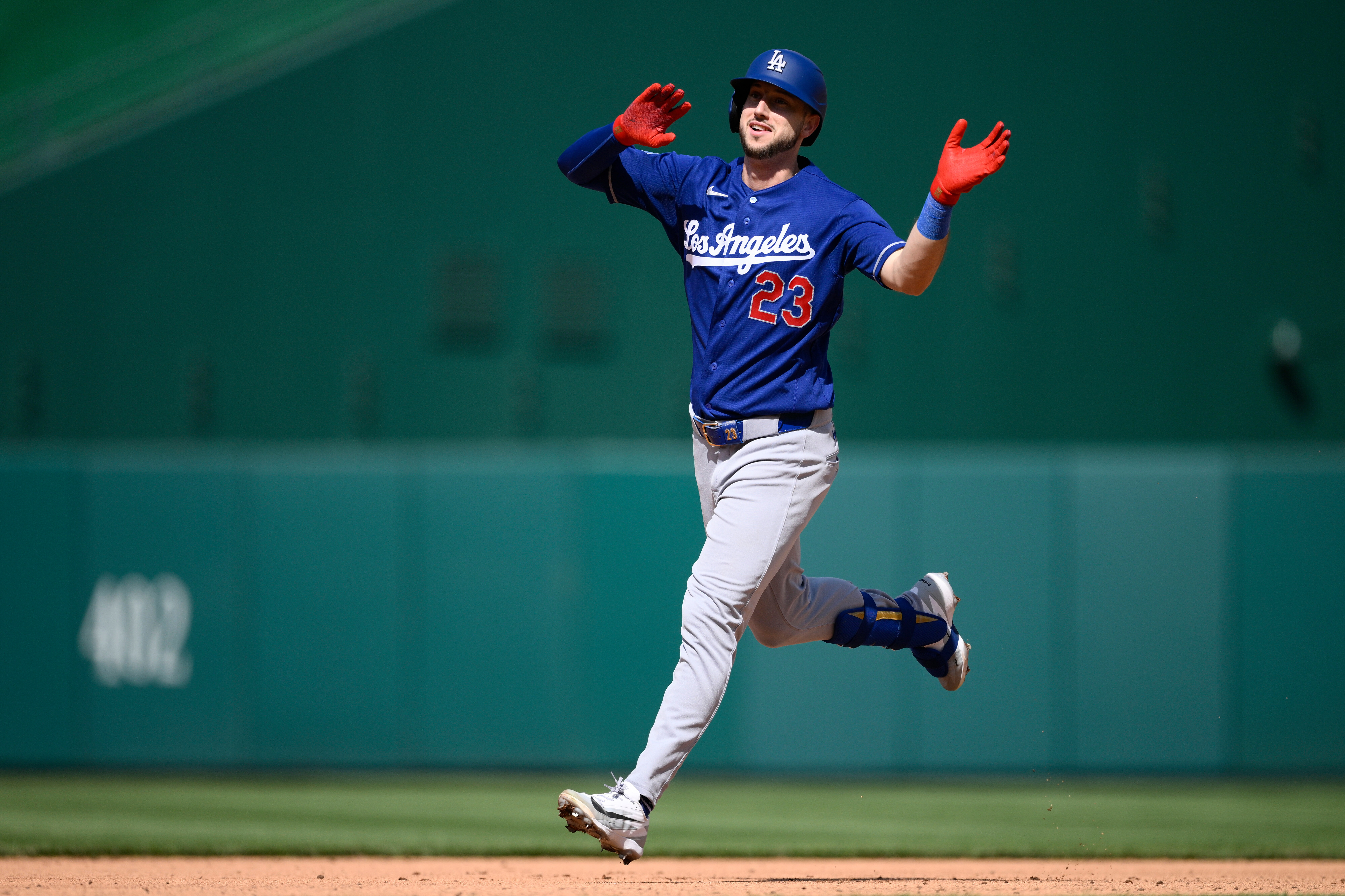 The Dodgers’ Kyle Tucker celebrates his home run as he...