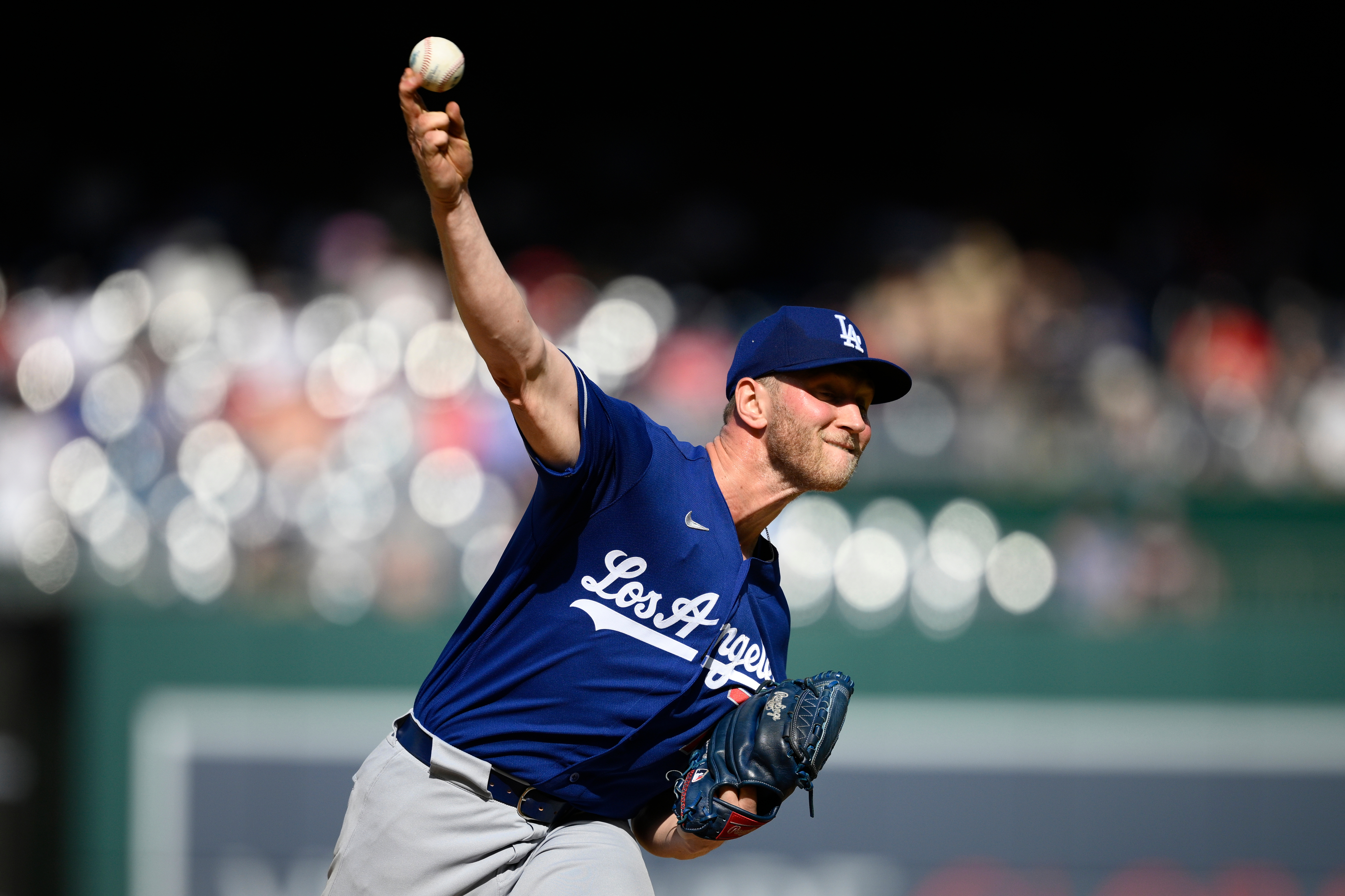 Dodgers relief pitcher Ben Casparius throws to the plate during...