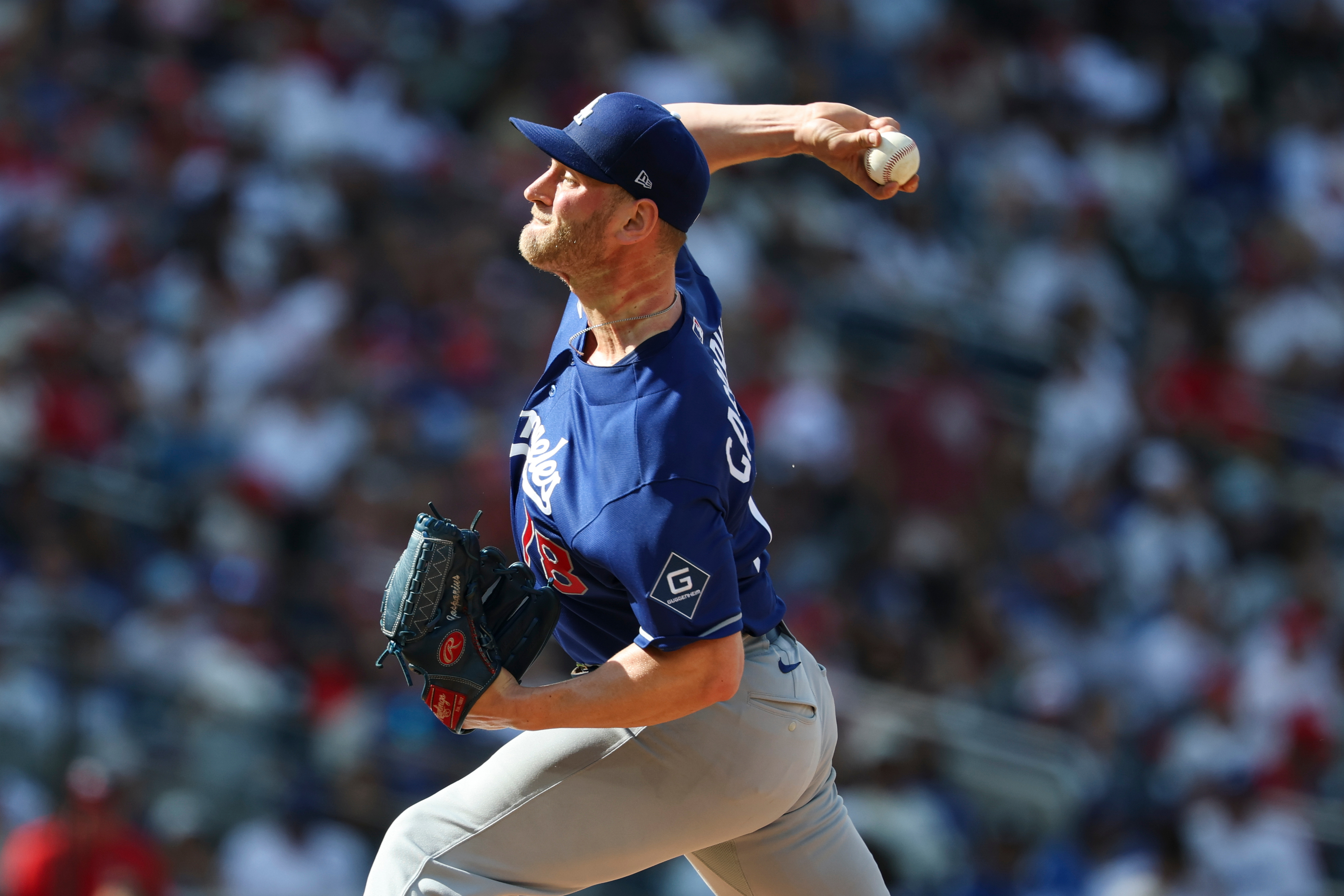 Dodgers relief pitcher Ben Casparius throws to the plate during...