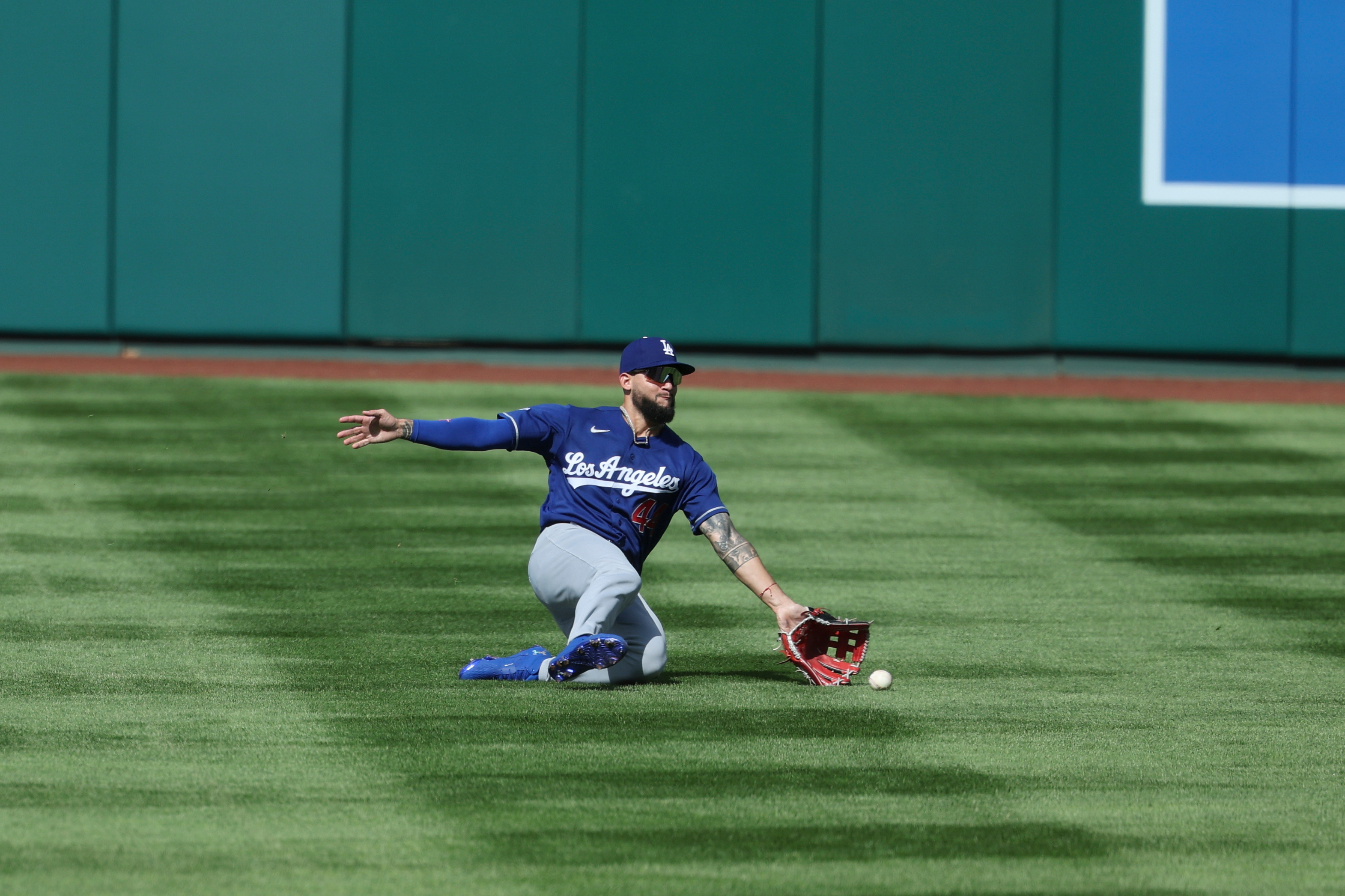 Dodgers center fielder Andy Pages attempts to catch a double...