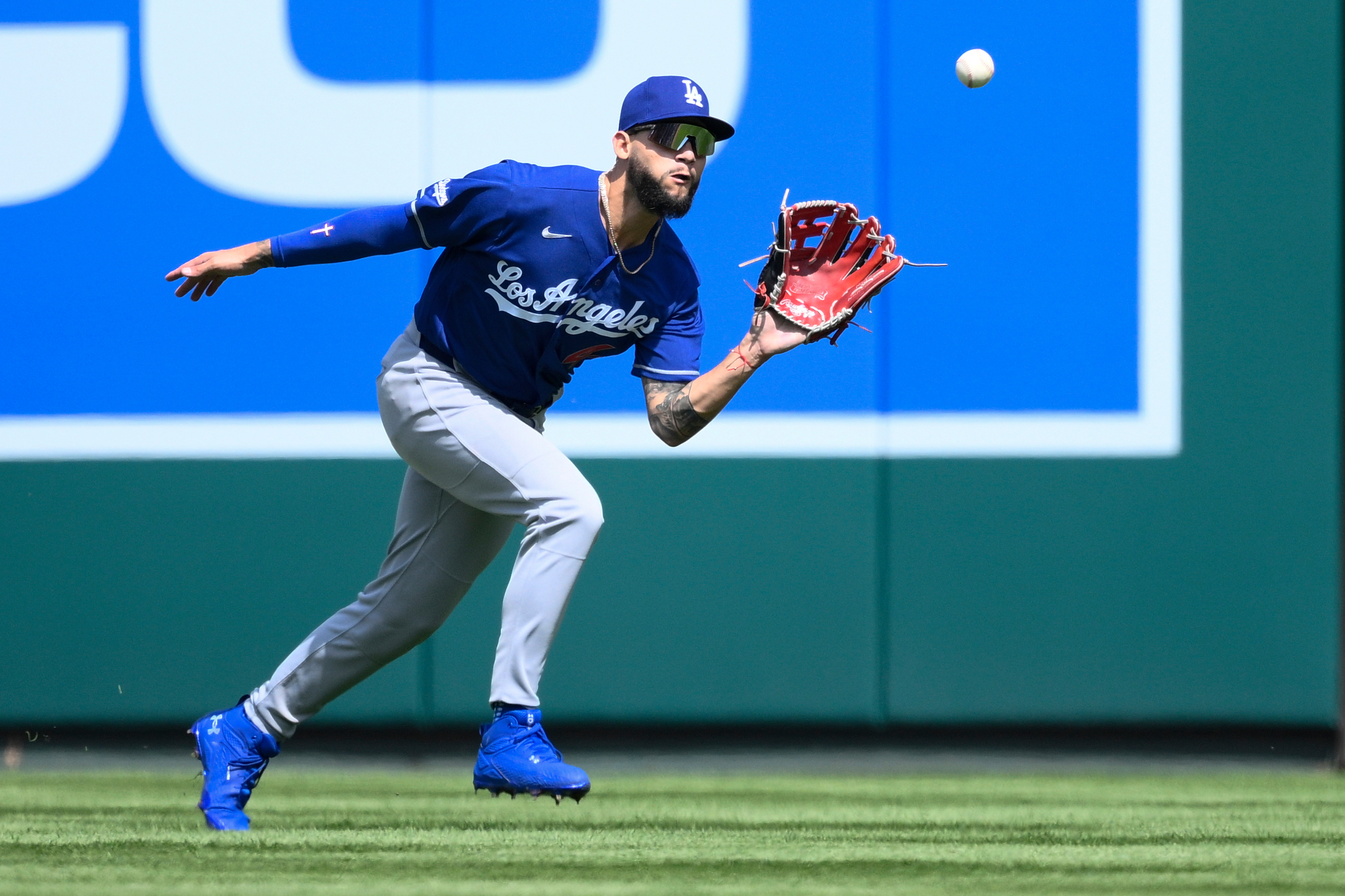 Dodgers center fielder Andy Pages catches a fly ball hit...