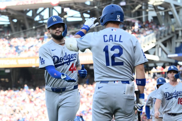 Los Angeles Dodgers' Andy Pages celebrates his three-run home run with Alex Call (12) during the fifth inning of a baseball game against the Washington Nationals, Saturday, April 4, 2026, in Washington. (AP Photo/Nick Wass)