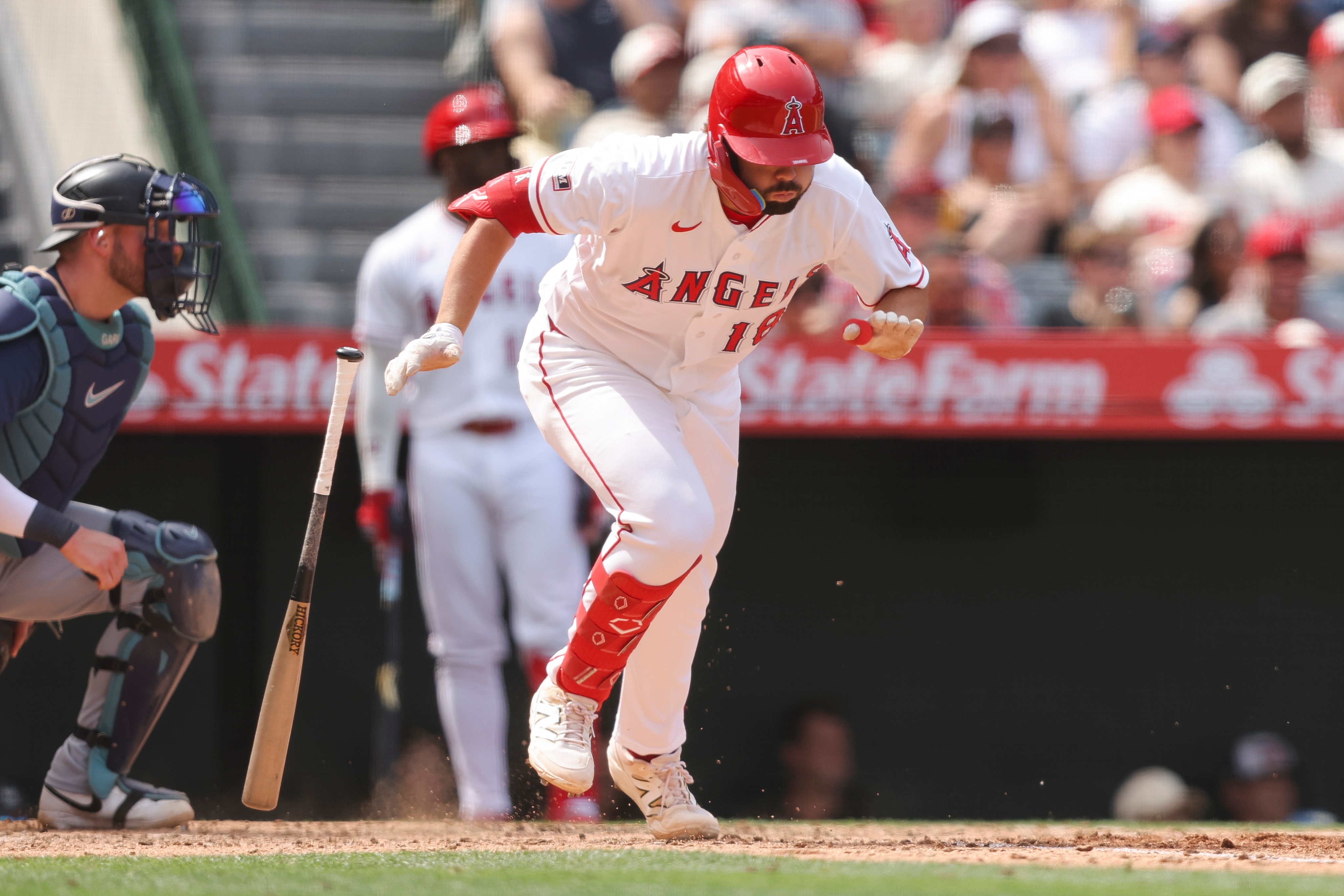 Angels’ Nolan Schanuel drops his bat after driving in a...