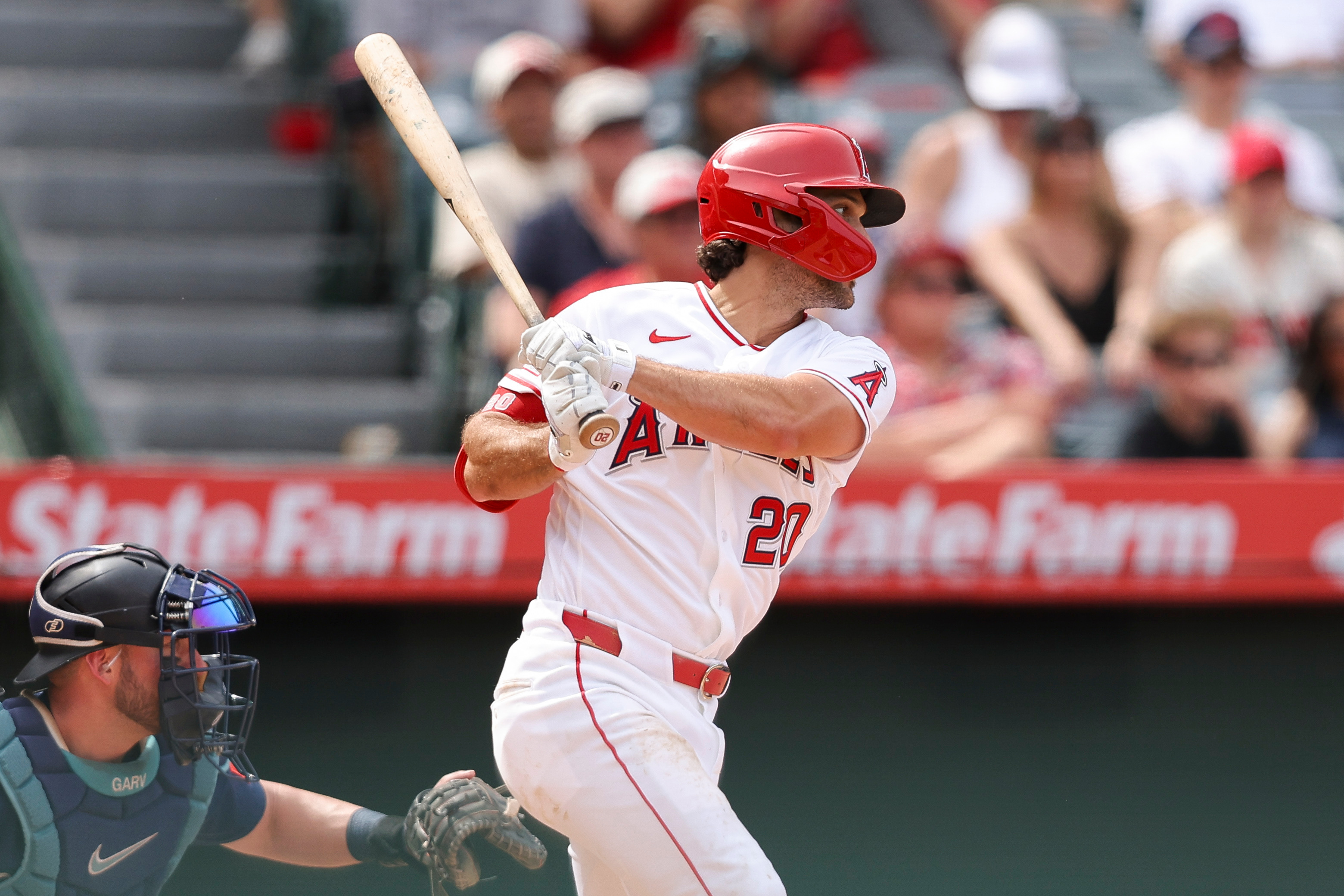 Angels’ Adam Frazier follows through on an RBI single during...