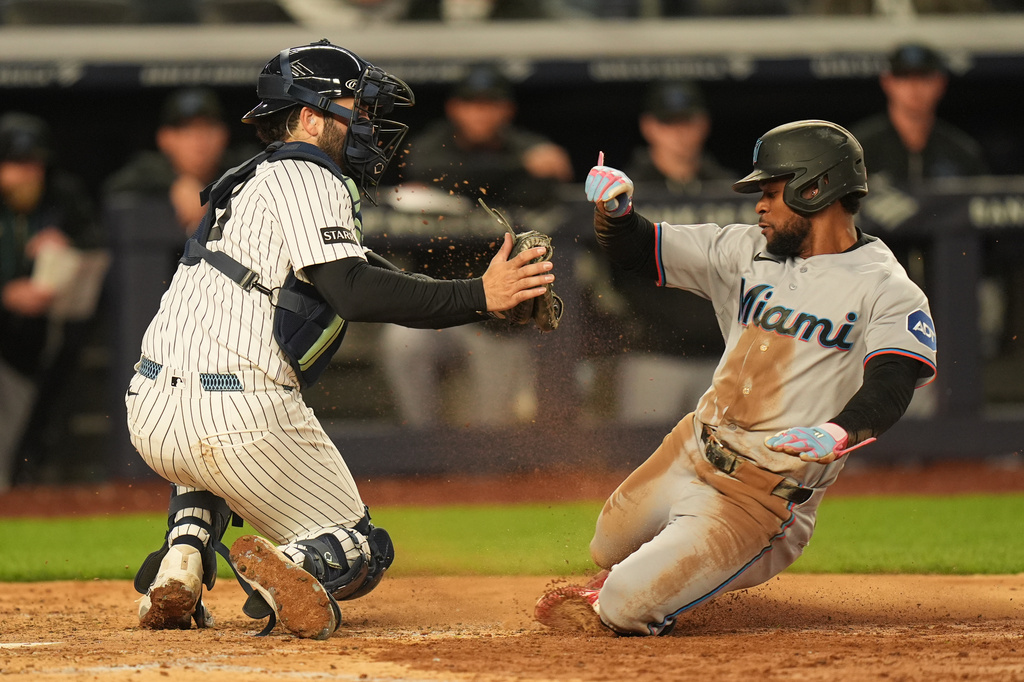 After long rain delay, Yankees’ bullpen falters in loss to Marlins