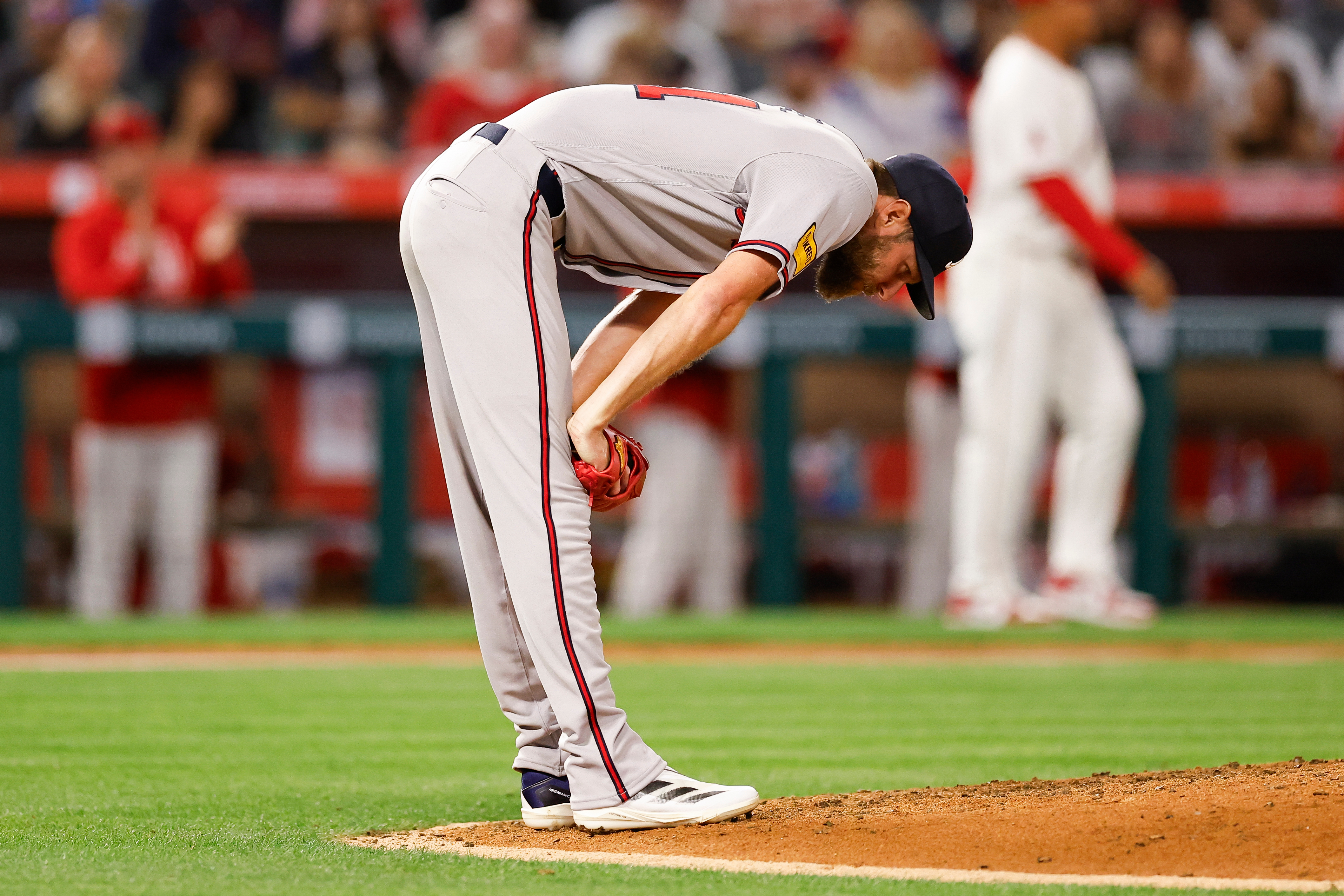 Atlanta Braves starting pitcher Chris Sale shows his frustration after...