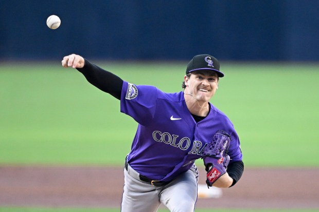 Colorado Rockies starting pitcher Ryan Feltner (18) delivers during the first inning of a baseball game against the San Diego Padres Saturday, April 11, 2026, in San Diego. (AP Photo/Denis Poroy)