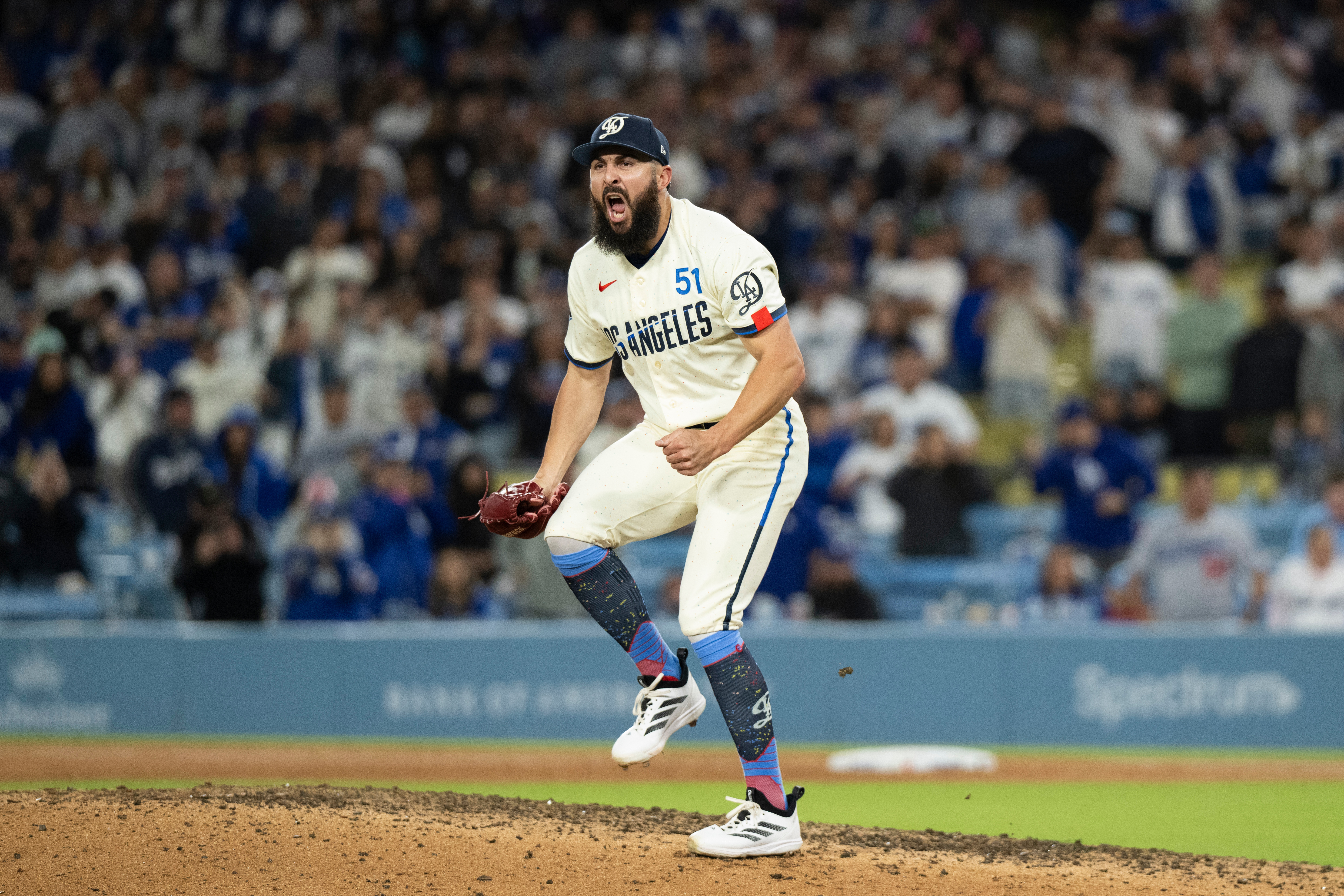 Dodgers relief pitcher Alex Vesia reacts after striking out Texas...