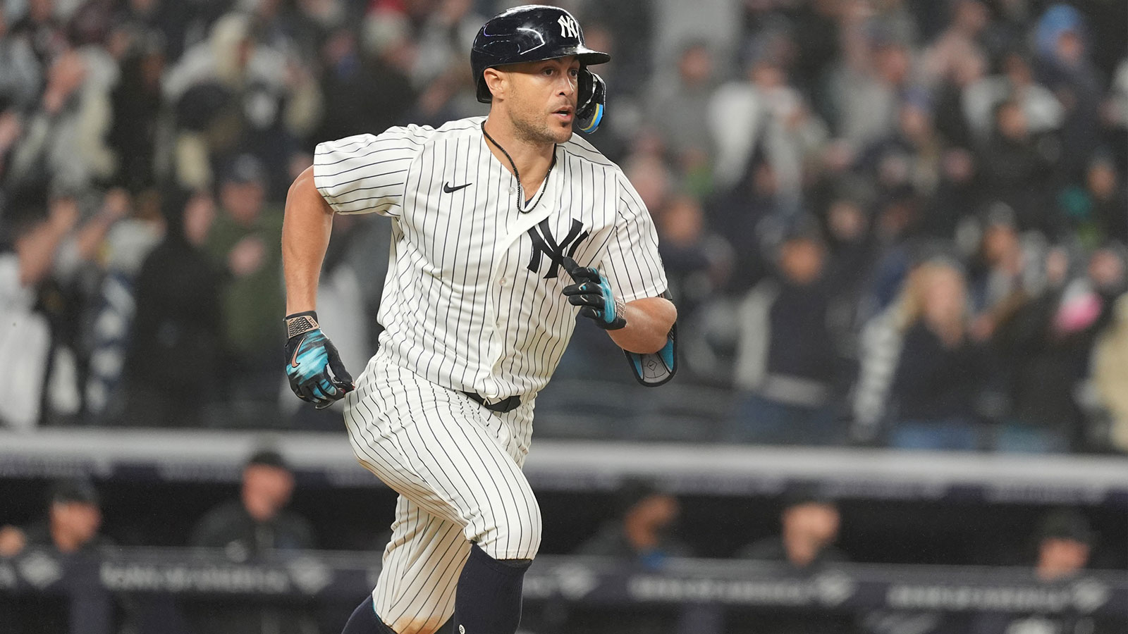 New York Yankees designated hitter Giancarlo Stanton (27) runs out an RBI single against the Miami Marlins during the eighth inning at Yankee Stadium. Mandatory Credit: Gregory Fisher-Imagn Images