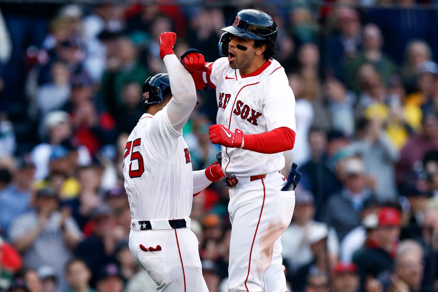 Carlos Narvaez (left) and Marcelo Mayer celebrate Mayer’s home run in the sixth inning.