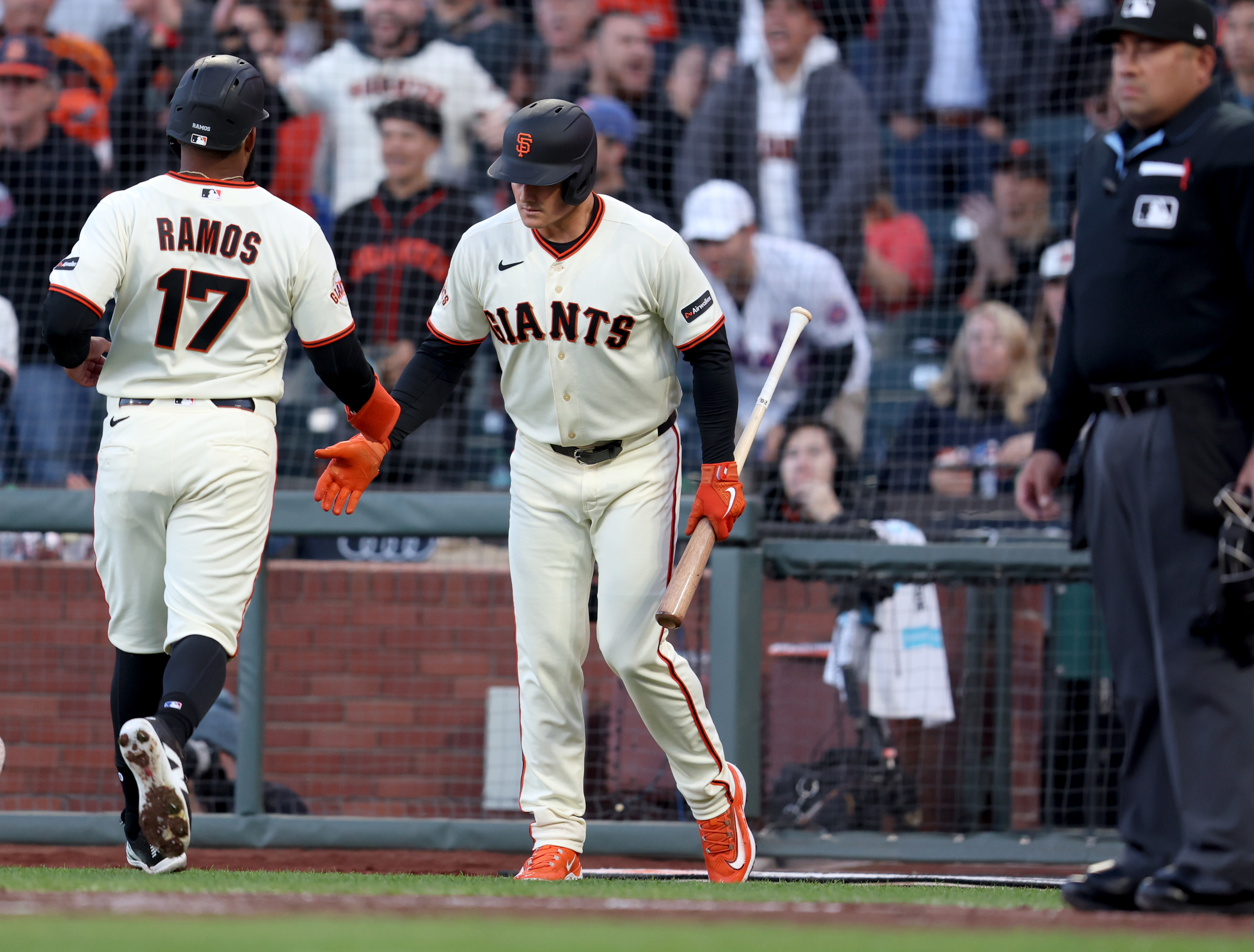 San Francisco Giants' Heliot Ramos #17 is congratulated by Matt...