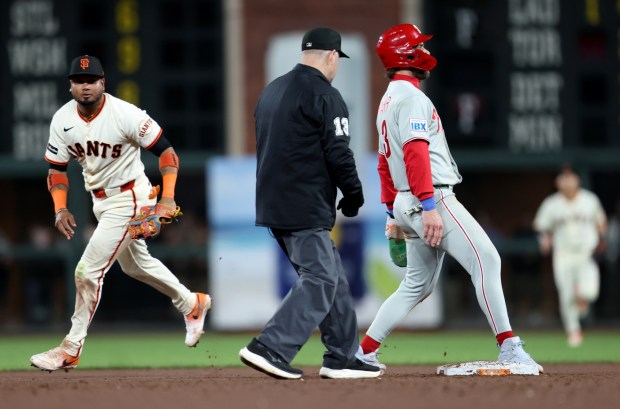 Philadelphia Phillies' first baseman Bryce Harper #3 reacts after being called out on a steal attempt after being tagged by San Francisco Giants second baseman Luis Arraez #1 in the eighth inning of their game at Oracle Park in San Francisco, Calif., on Monday, April 6, 2026. (Jane Tyska/Bay Area News Group)