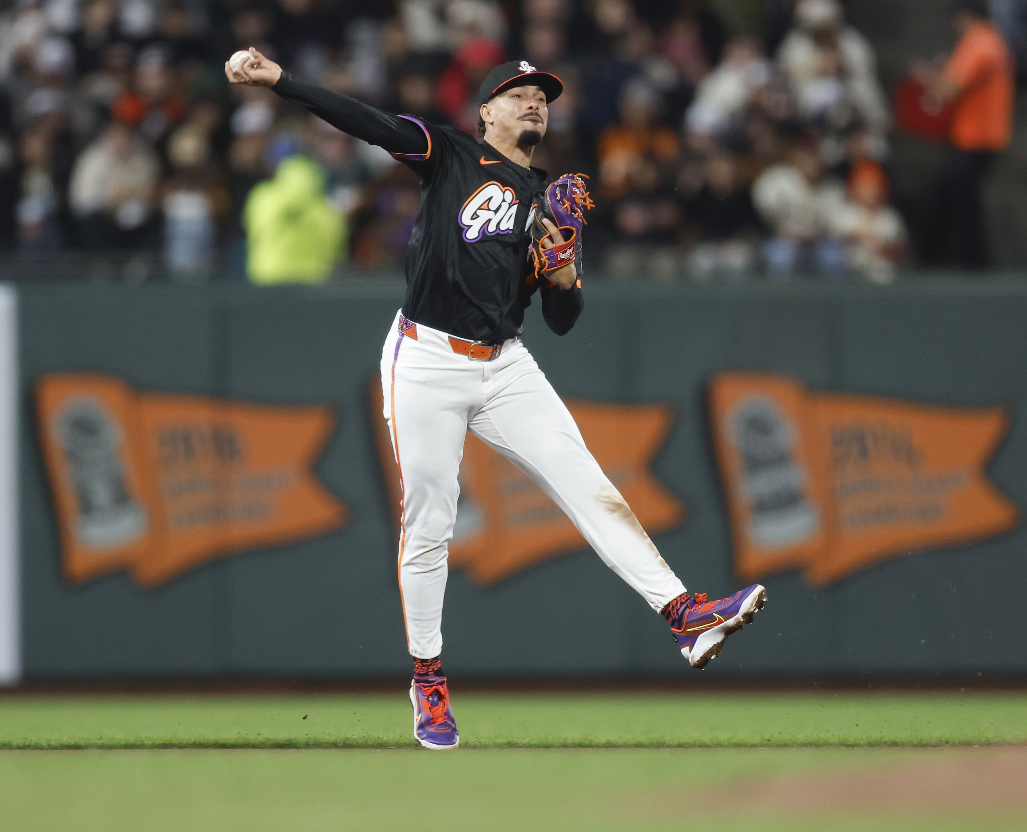 San Francisco Giants’ Willy Adames (2) throws to first base...