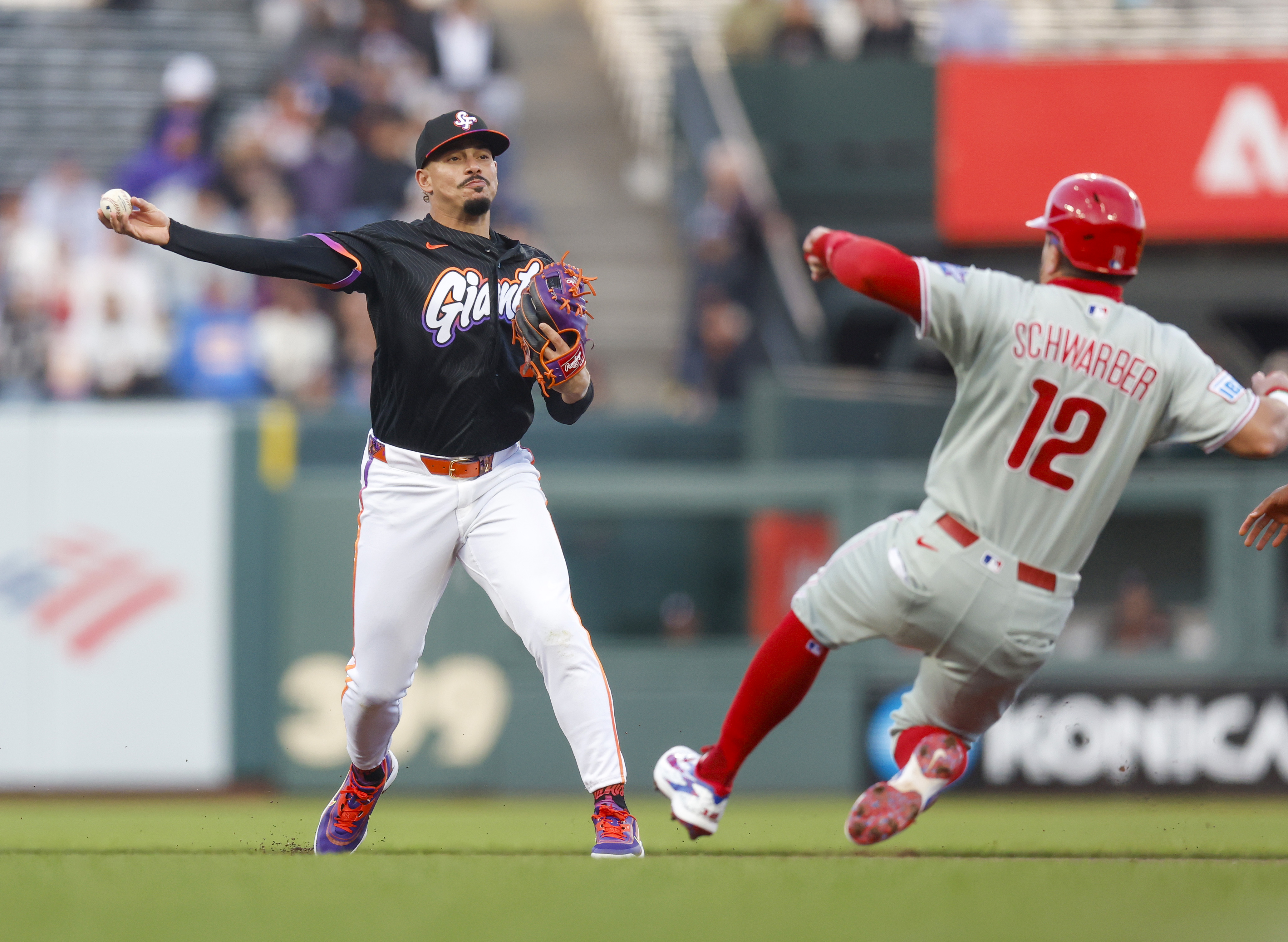 San Francisco Giants’ Willy Adames (2) throws to first base...
