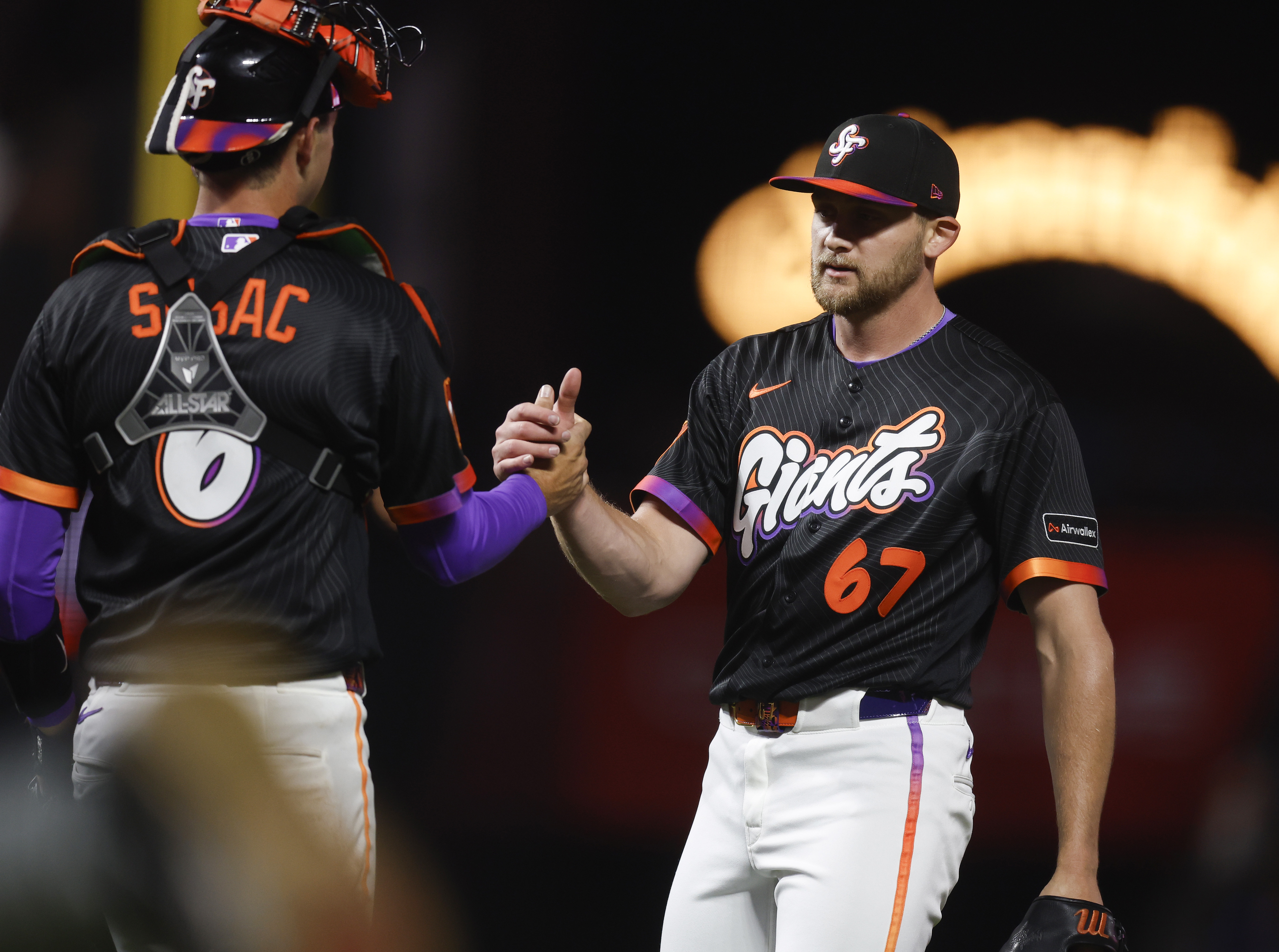 San Francisco Giants’ Keaton Winn (67) high-fives San Francisco Giants’...