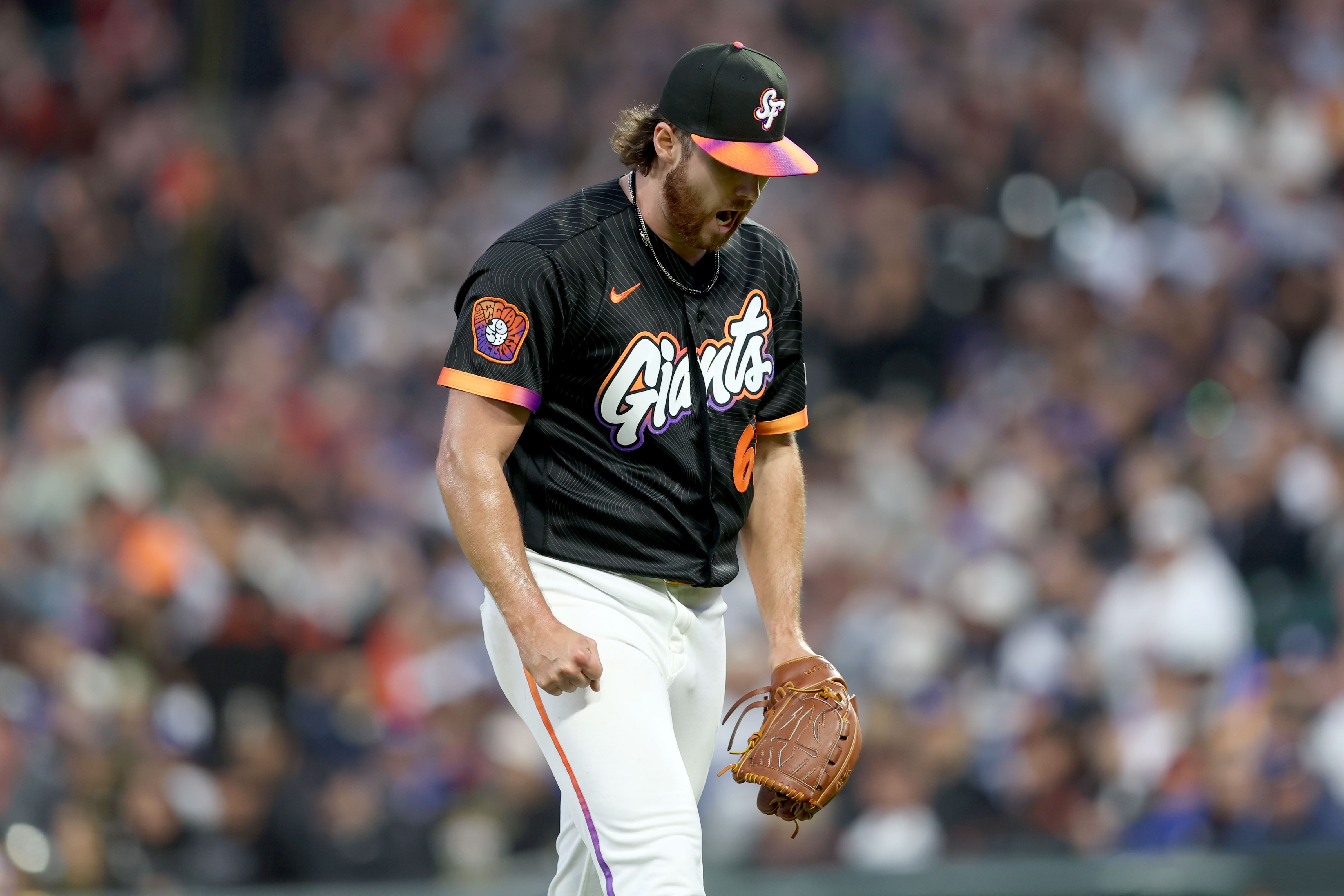 San Francisco Giants starting pitcher Landen Roupp (65) reacts after...