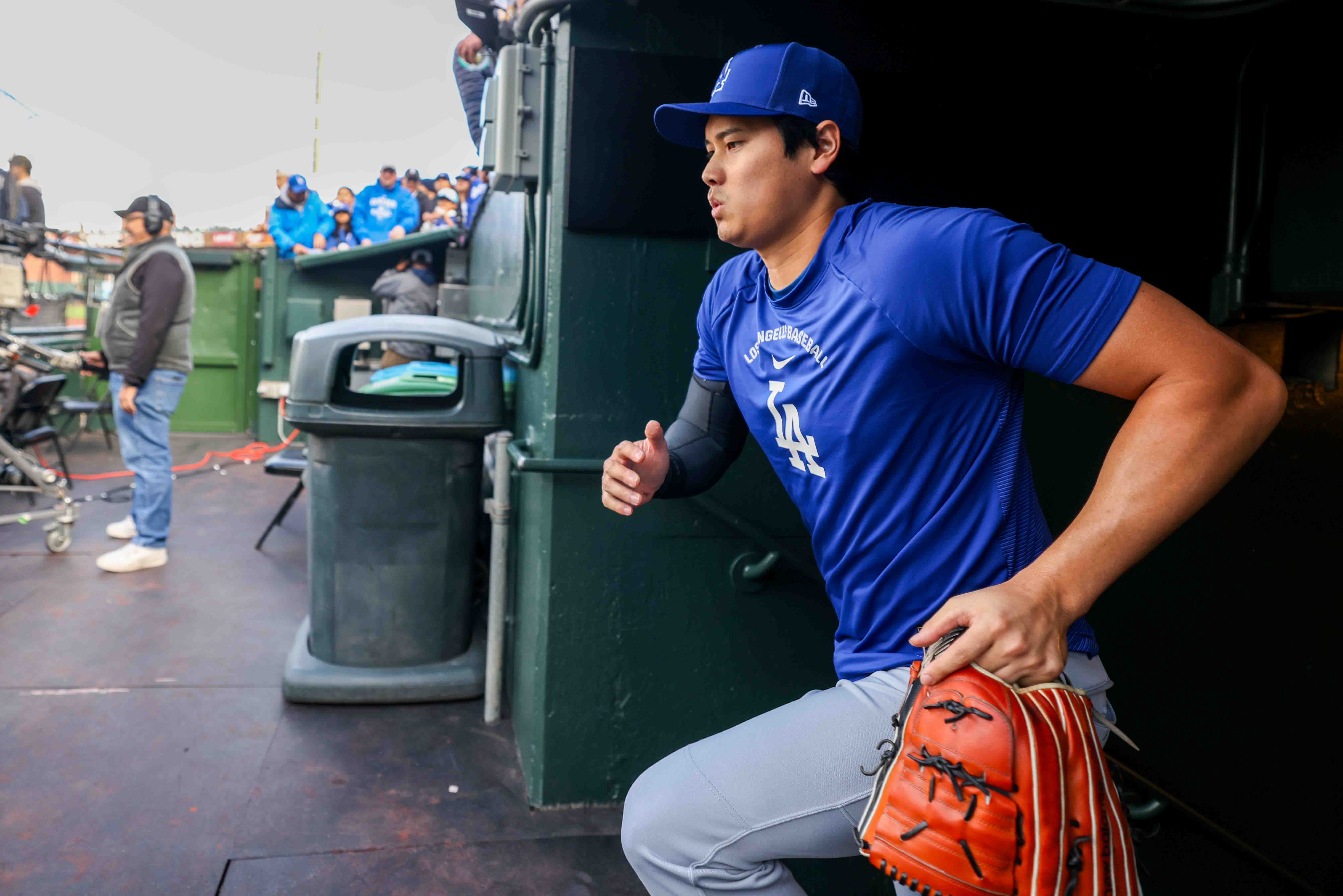 Los Angeles Dodgers’s Shohei Ohtani (17) heads to the field...