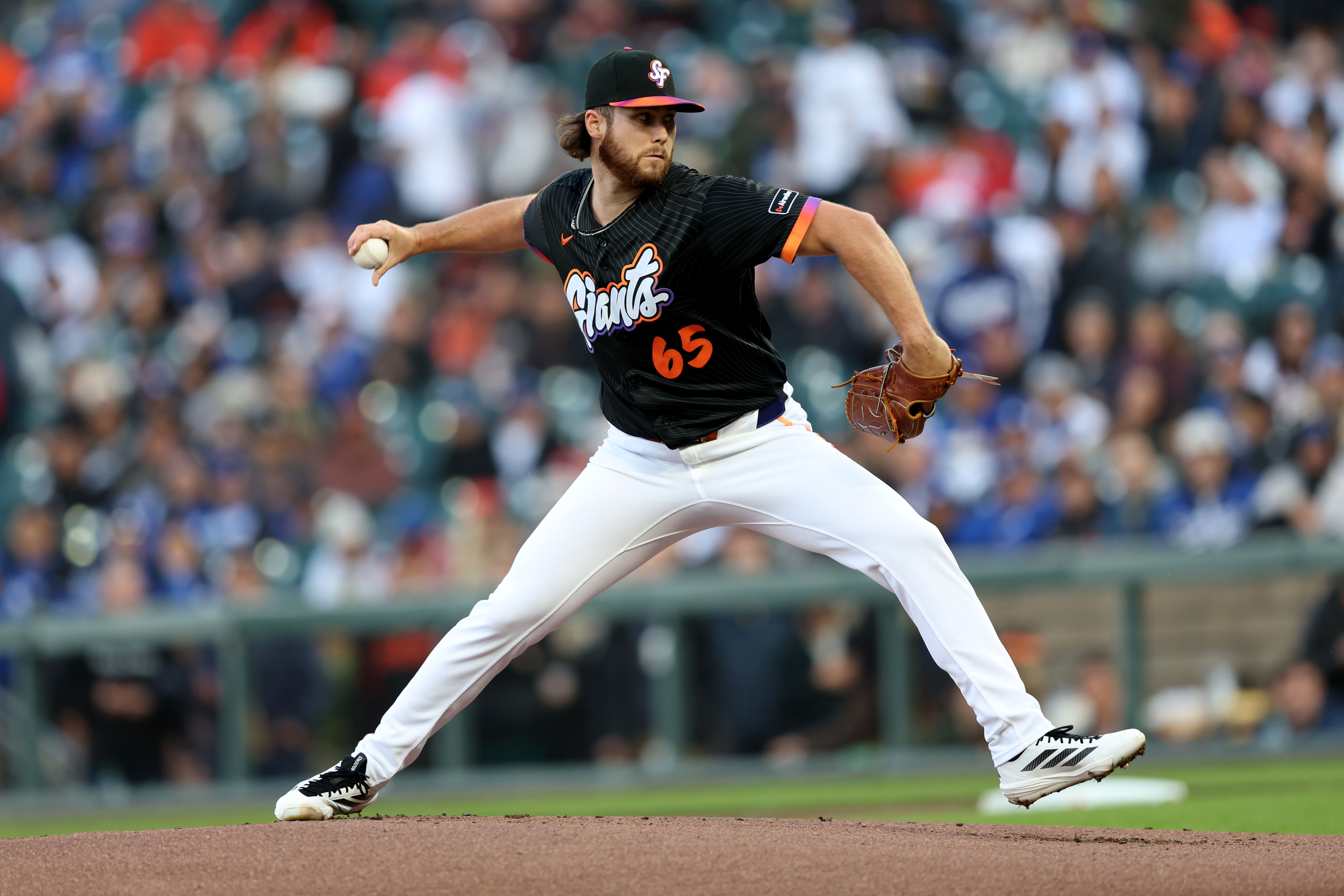 San Francisco Giants starting pitcher Landen Roupp (65) pitches against...