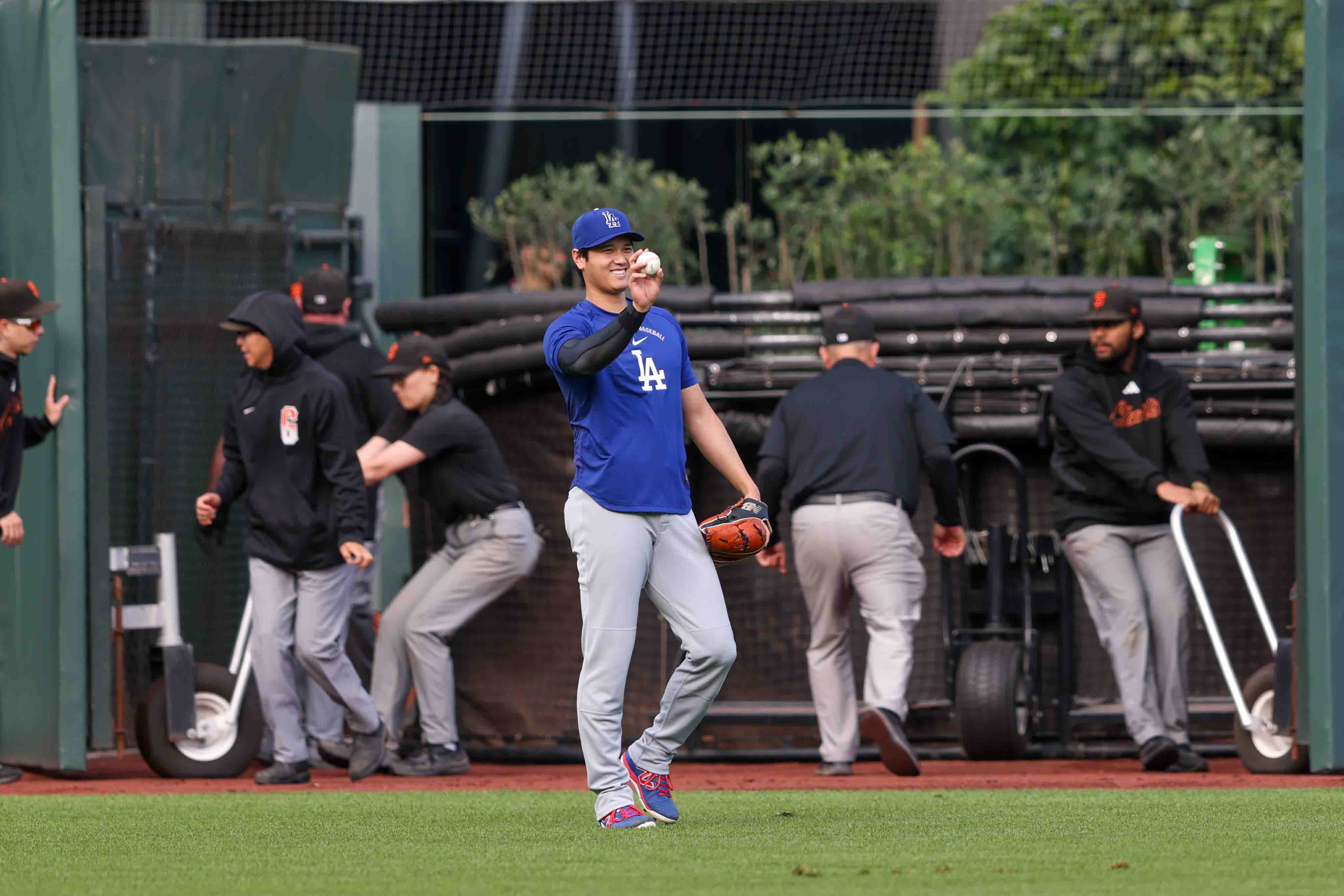 Los Angeles Dodgers’s Shohei Ohtani (17) gestures during warmups before...