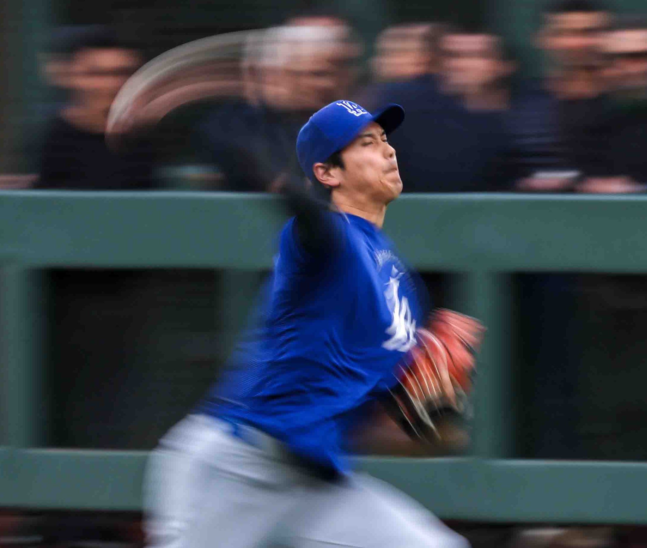 Los Angeles Dodgers’s Shohei Ohtani (17) throws the ball during...
