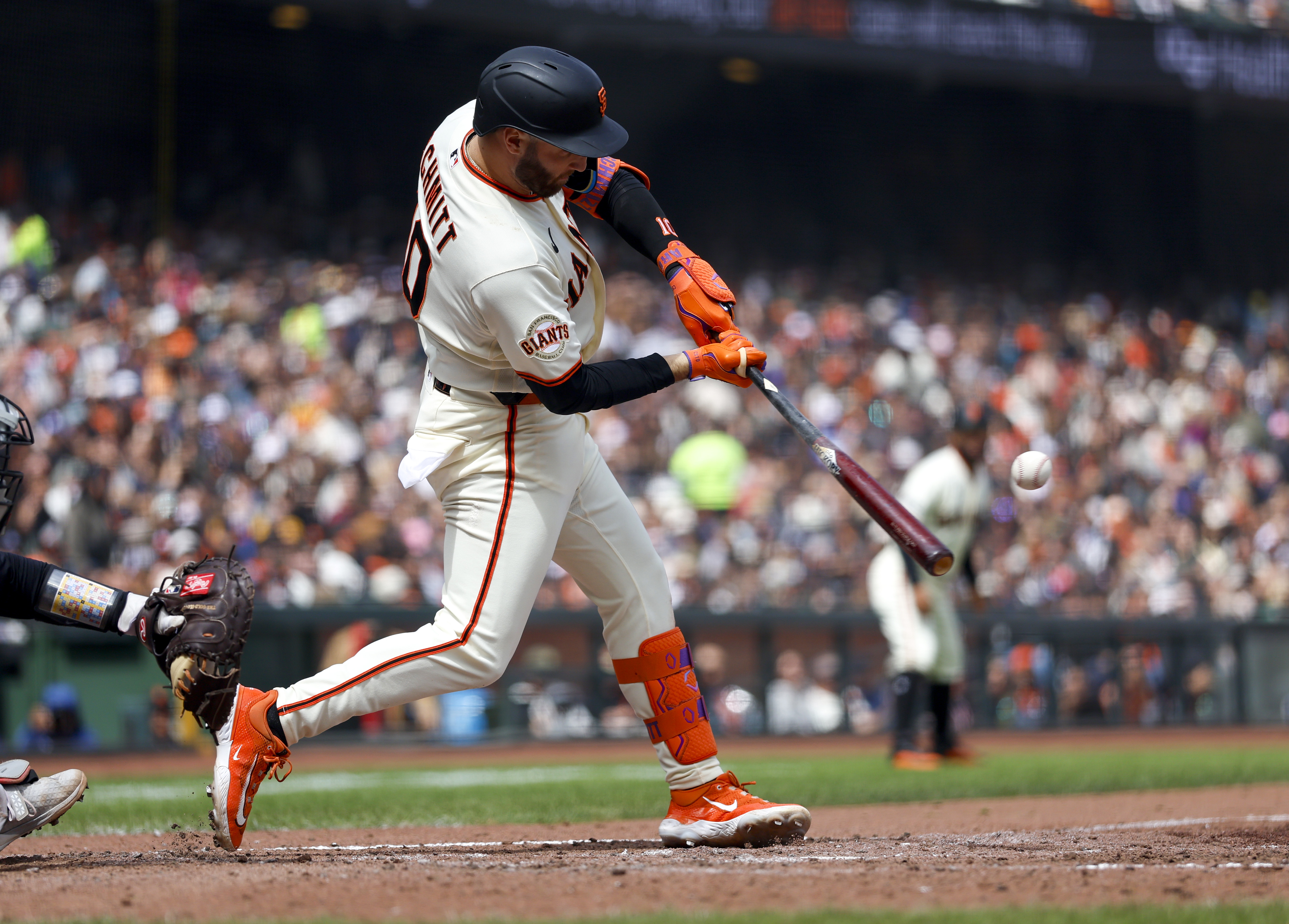 Giants' designated hitter Casey Schmitt hits a three-run home run...