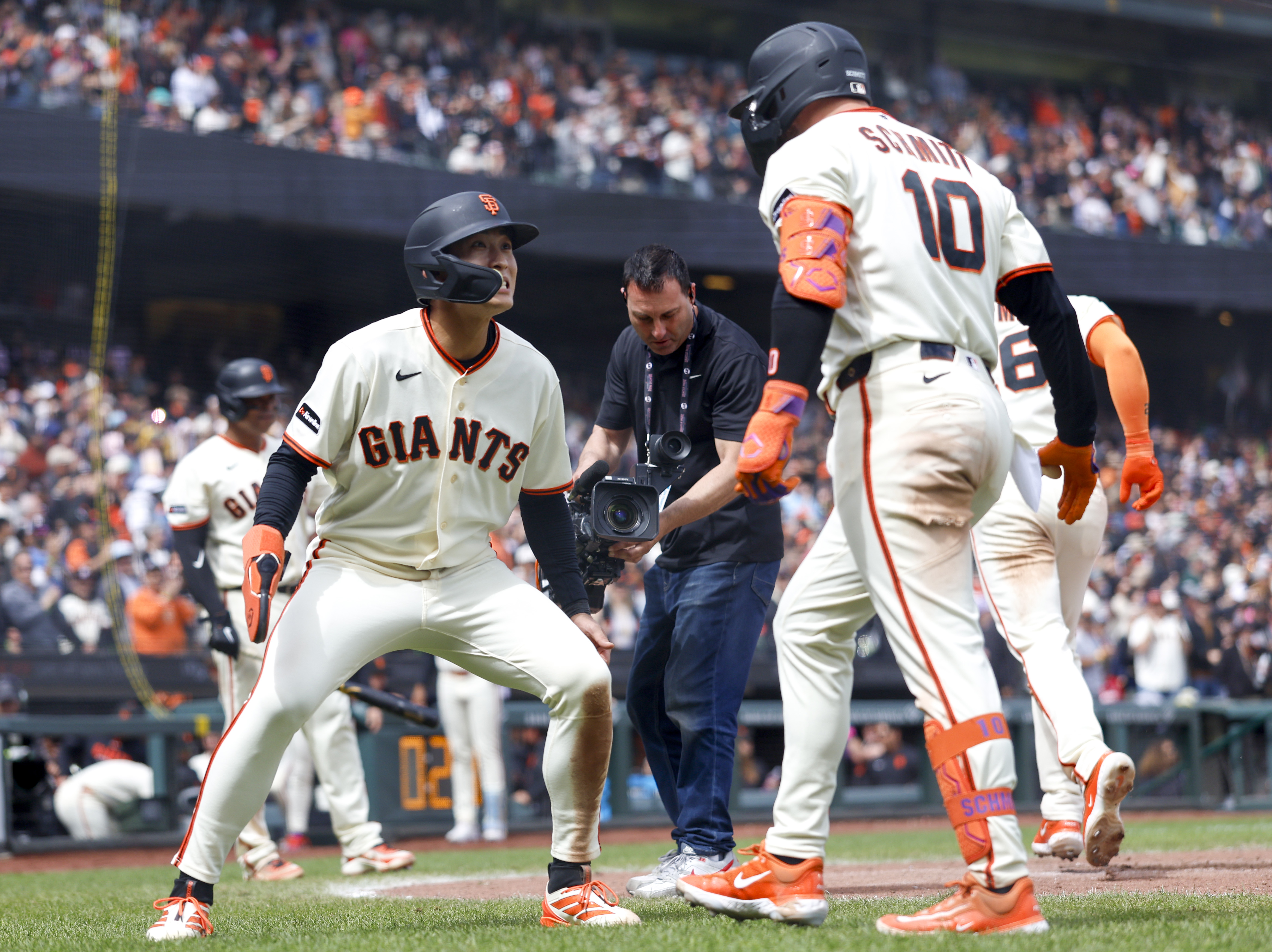 San Francisco Giants’ Casey Schmitt (10) celebrates his three-run home...