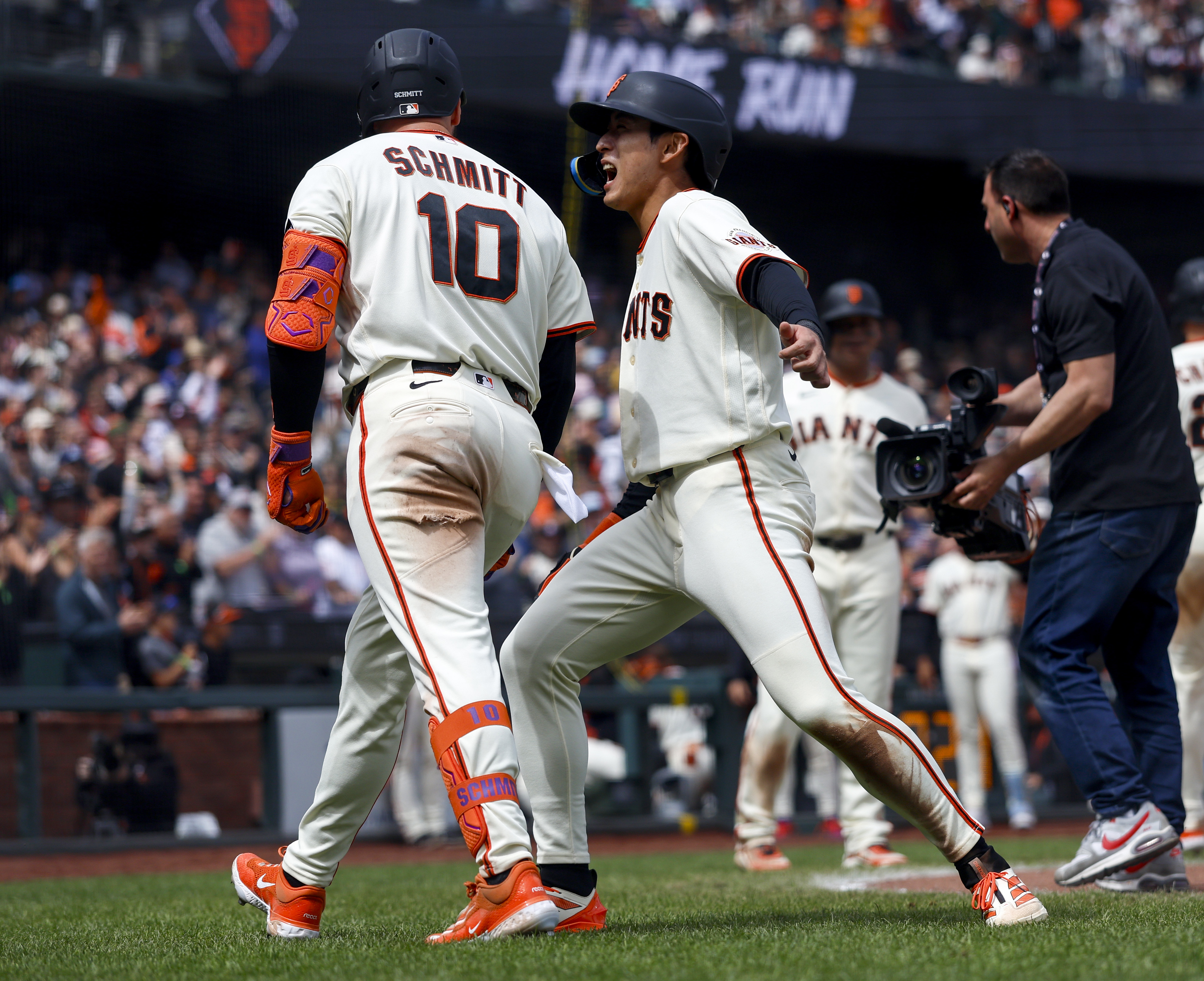 San Francisco Giants’ Casey Schmitt (10) celebrates his three-run home...