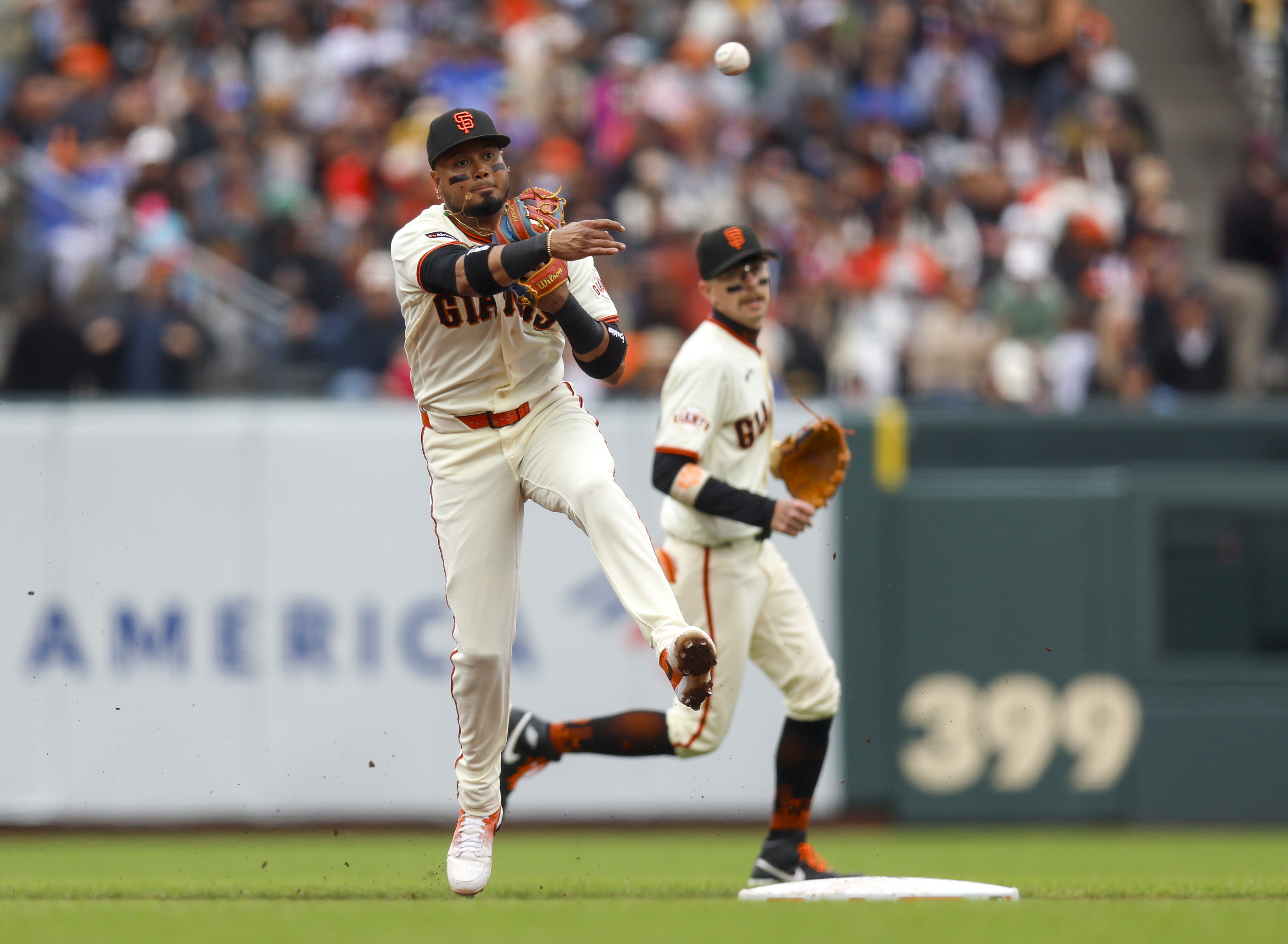 San Francisco Giants’ Luis Arraez (1) throws to first base...